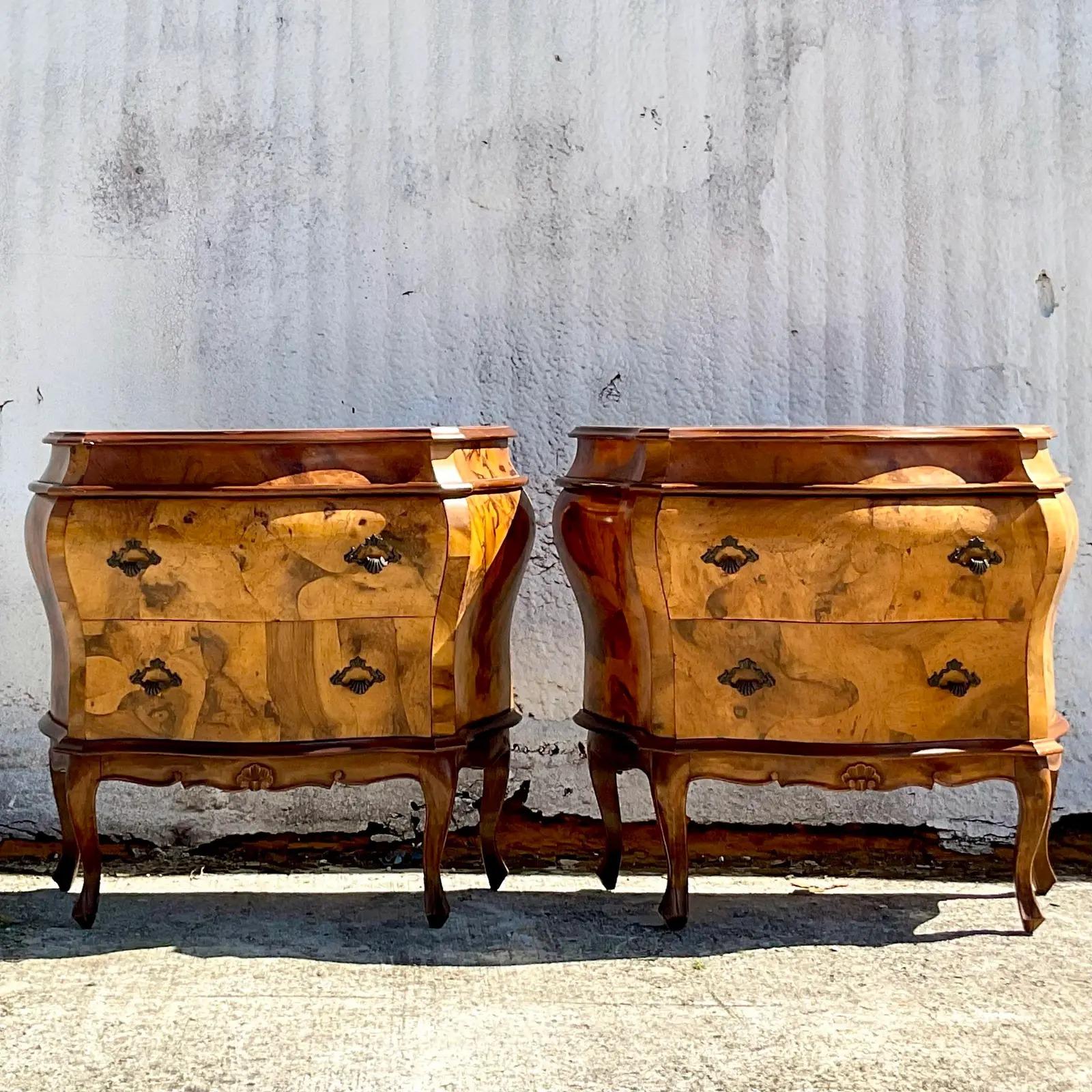 A spectacular pair of vintage Regency Italian Chests. Beautiful patchwork Olive Burl wood with brass hardware. Incredible wood grain detail. Acquired from a Palm Beach estate.