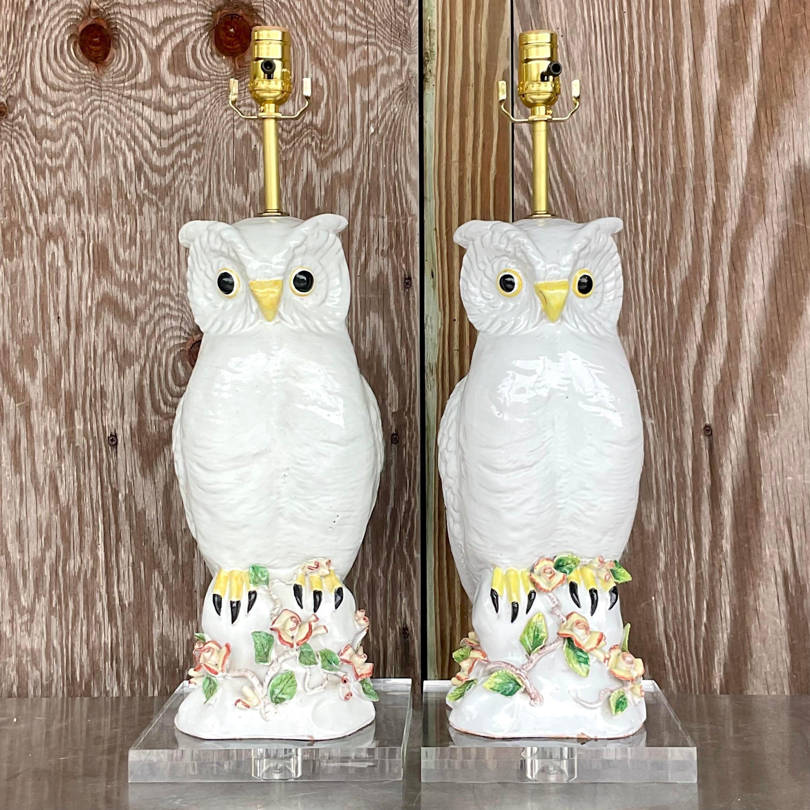 A fabulous pair of vintage Regency table lamps. A handsome pair of terra cotta owls with hand painted detail. Fully restored with all new wiring, hardware and lucite plinths. Acquired from a Palm Beach estate.