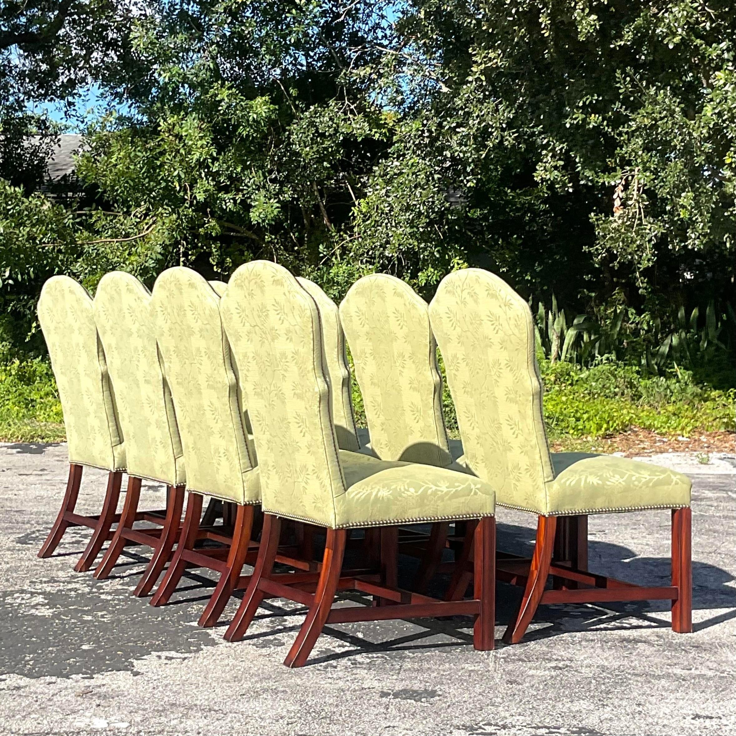 A stunning set of 8 vintage Regency dining chairs. A brilliant green jacquard with gorgeous nailhead trim. Acquired from a Delray estate. 
