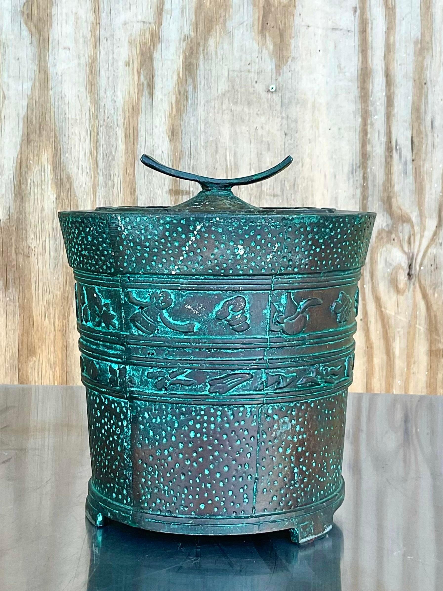 A fantastic rare MCM Regency champagne bucket. Made by the highly coveted James Mint. Beautiful patinated finish with beautiful carved detail. Matching pieces also available on my Chairish page. Acquired from a Palm Beach estate. 