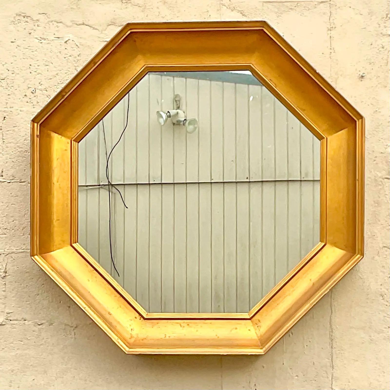 A fantastic vintage Gilt octagon mirror. Made by the legendary John Widdicomb. Tagged on the back. Acquired from a Palm Beach estate.