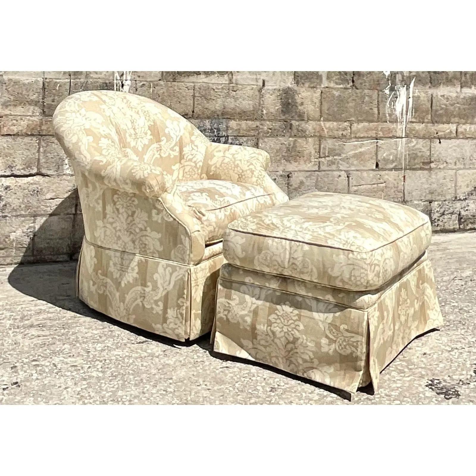 Fabulous vintage tufted chair and ottoman. Made by the iconic Kravet group. Beautiful printed upholstery in a fleur de lys design. Acquired from a Palm Beach estate.