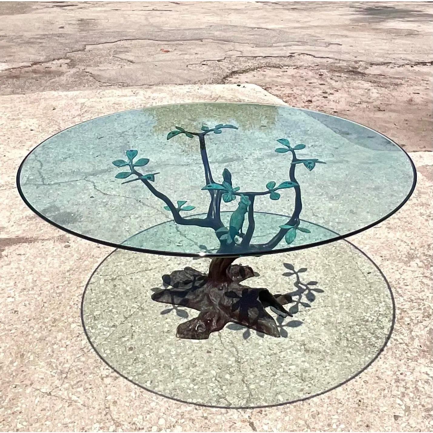 Exceptional vintage LaBarge dining table. Crafted from a heavy bronze with a beautiful partial patina. Thick glass top rests on the pedestals. Tagged . Acquired from a Palm Beach estate.