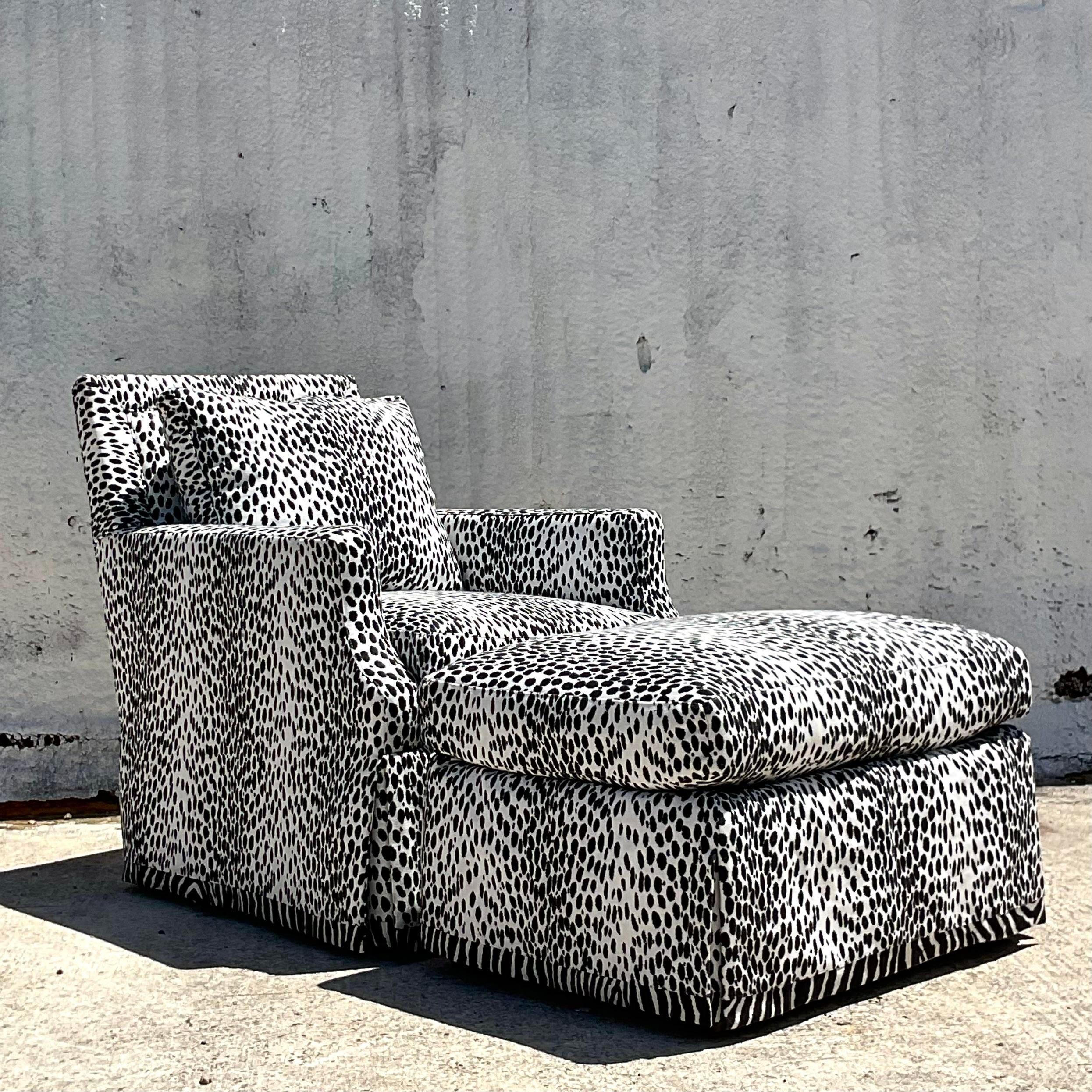 A stunning vintage Regency swivel chair and ottoman. Made by the iconic Lee Industries and tagged below the cushion. A brilliant graphic Bob Collins “Bobcat” animal print upholstery. Acquired from a Palm Beach estate.