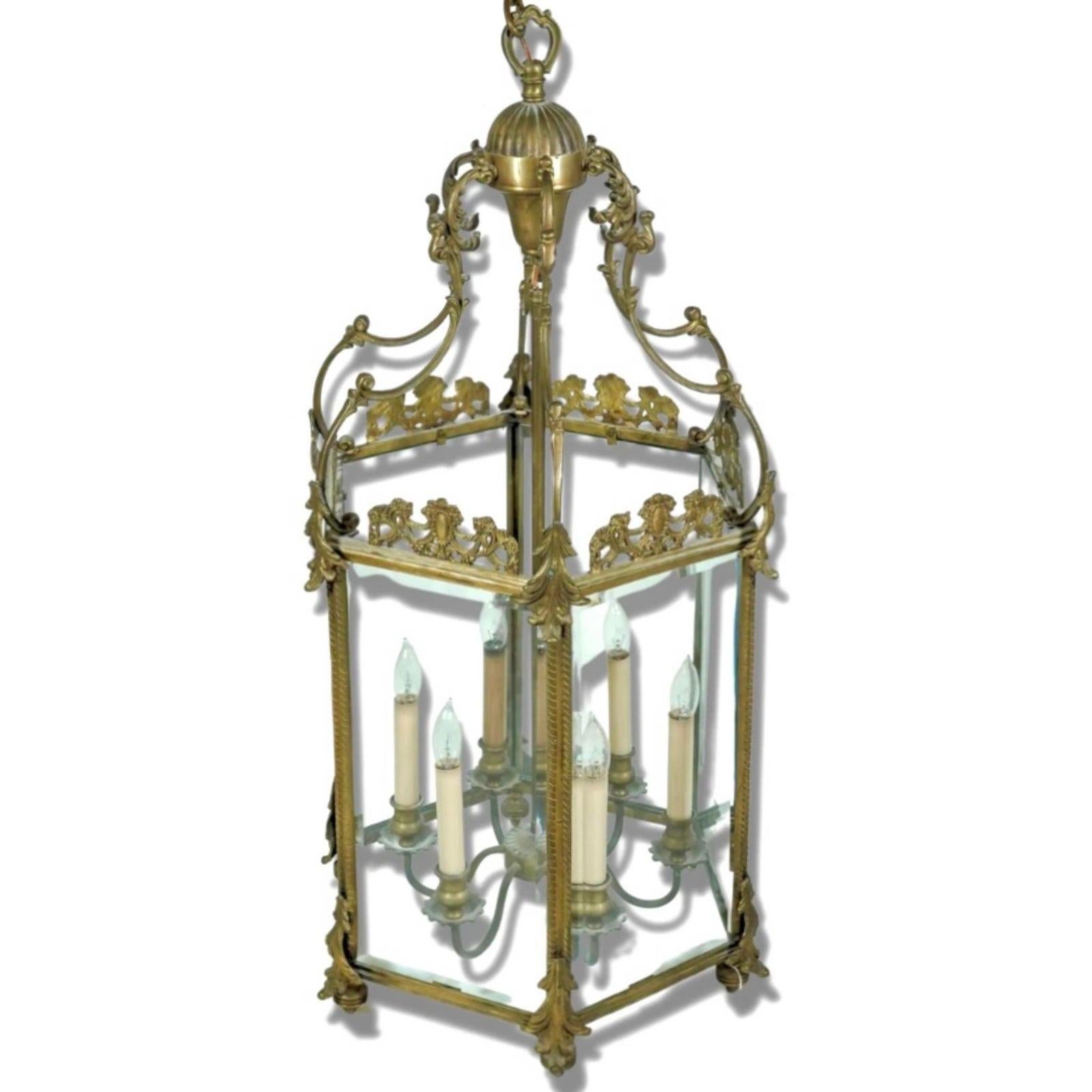 A stunning vintage Regency lantern. Done in the Louis VX style with. Bronze frame and gold finish. Inset glass panels. Perfect for your foyer or as a glamorous chandelier in your dining space. Acquired from a Palm Beach estate.