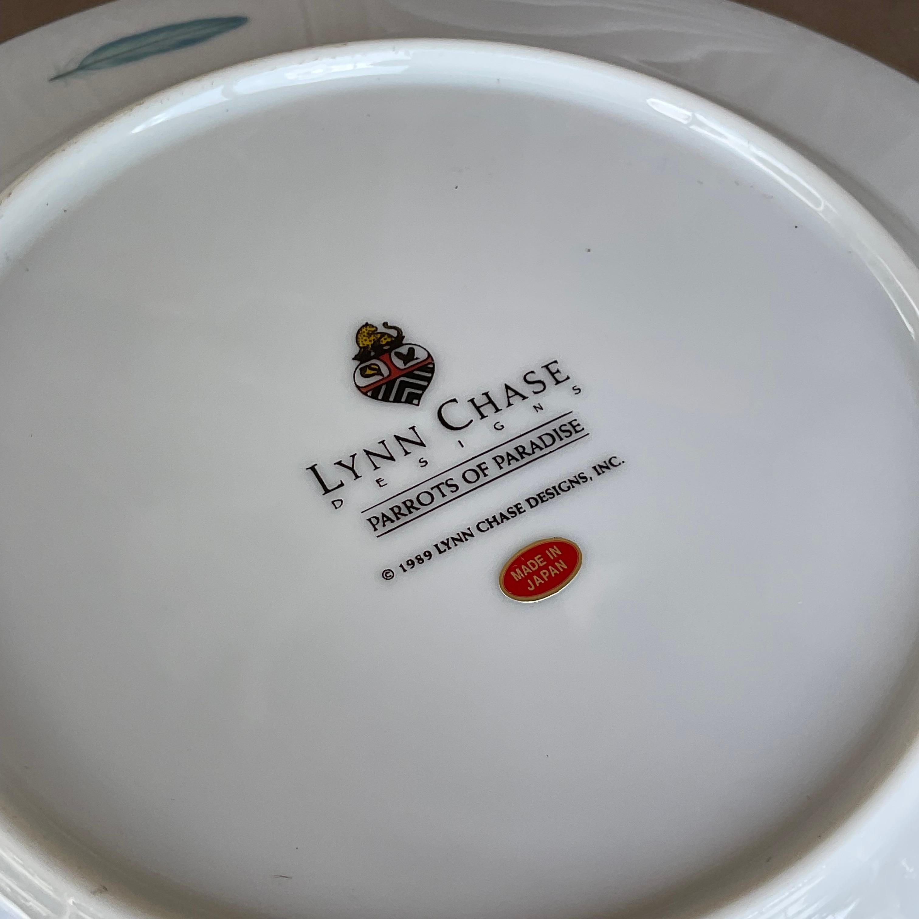 Elevate your dining experience with our Vintage Regency Lynn Chase 'Parrots In Paradise' Luncheon Plates - Set Of 8, epitomizing the fusion of American sophistication and exotic allure. Crafted with meticulous detail, each plate features vibrant