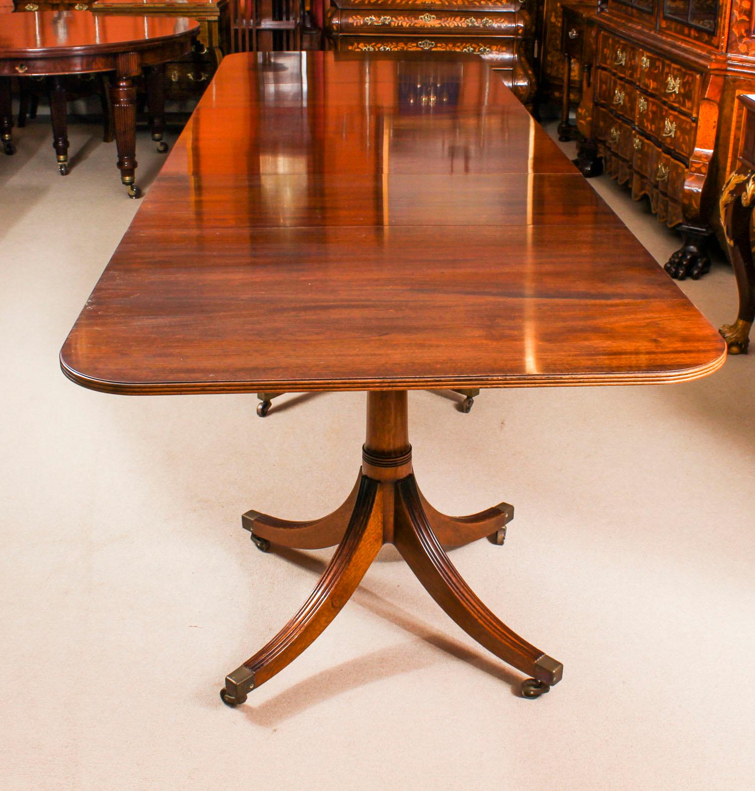 This is a fabulous high quality flame mahogany triple pillar extending dining table by the master cabinet maker, William Tillman, bought at great expense from Harrods, Knightsbridge, London in 1982.

It is raised on three gunbarrel bases, each