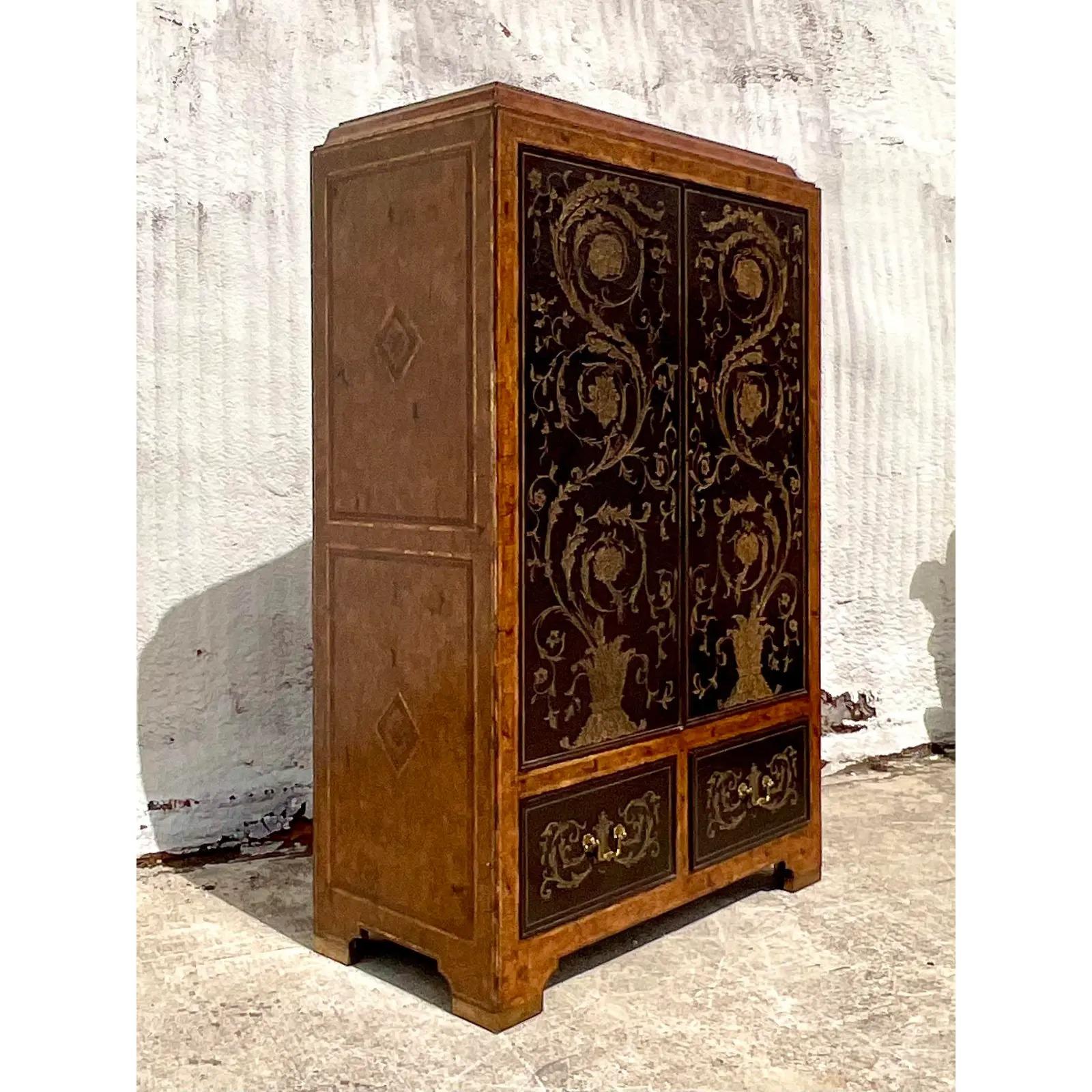 Fantastic vintage Regency armoire. Made by the iconic Maitland Smith group. Beautiful hand carved lacquer finish with a polished wood cabinet. Currently outfitted as a TV console, but easily converted to hanging or a chic mirrored dry bar. Tagged in