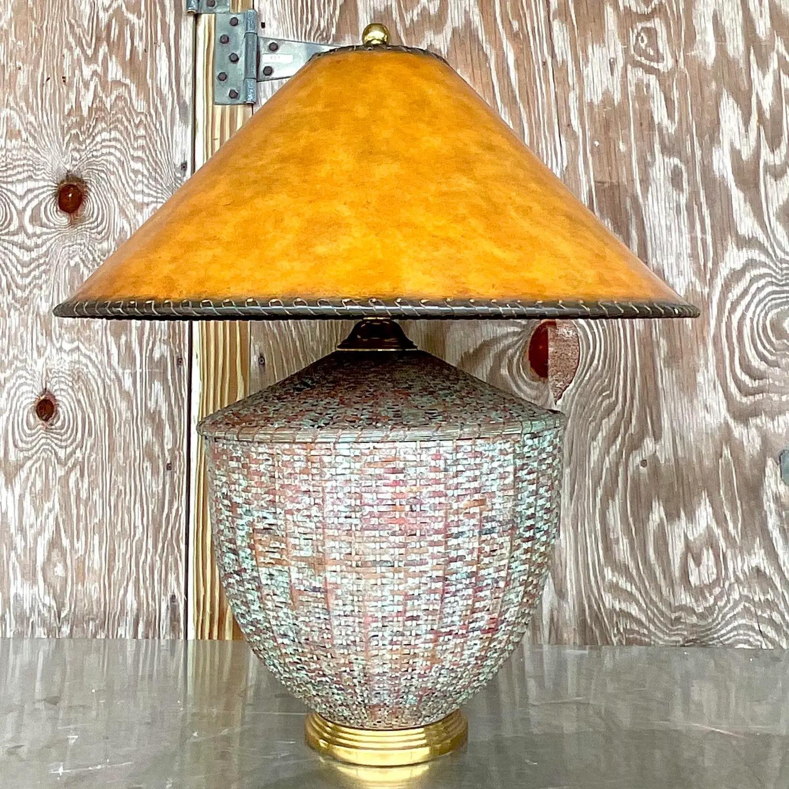 Fabulous vintage Regency table lamp. Made by the iconic Maitland Smith group. Beautiful patinated rattan with a chic leather shade. Marked on the bottom. Acquired from a Palm Beach estate.
