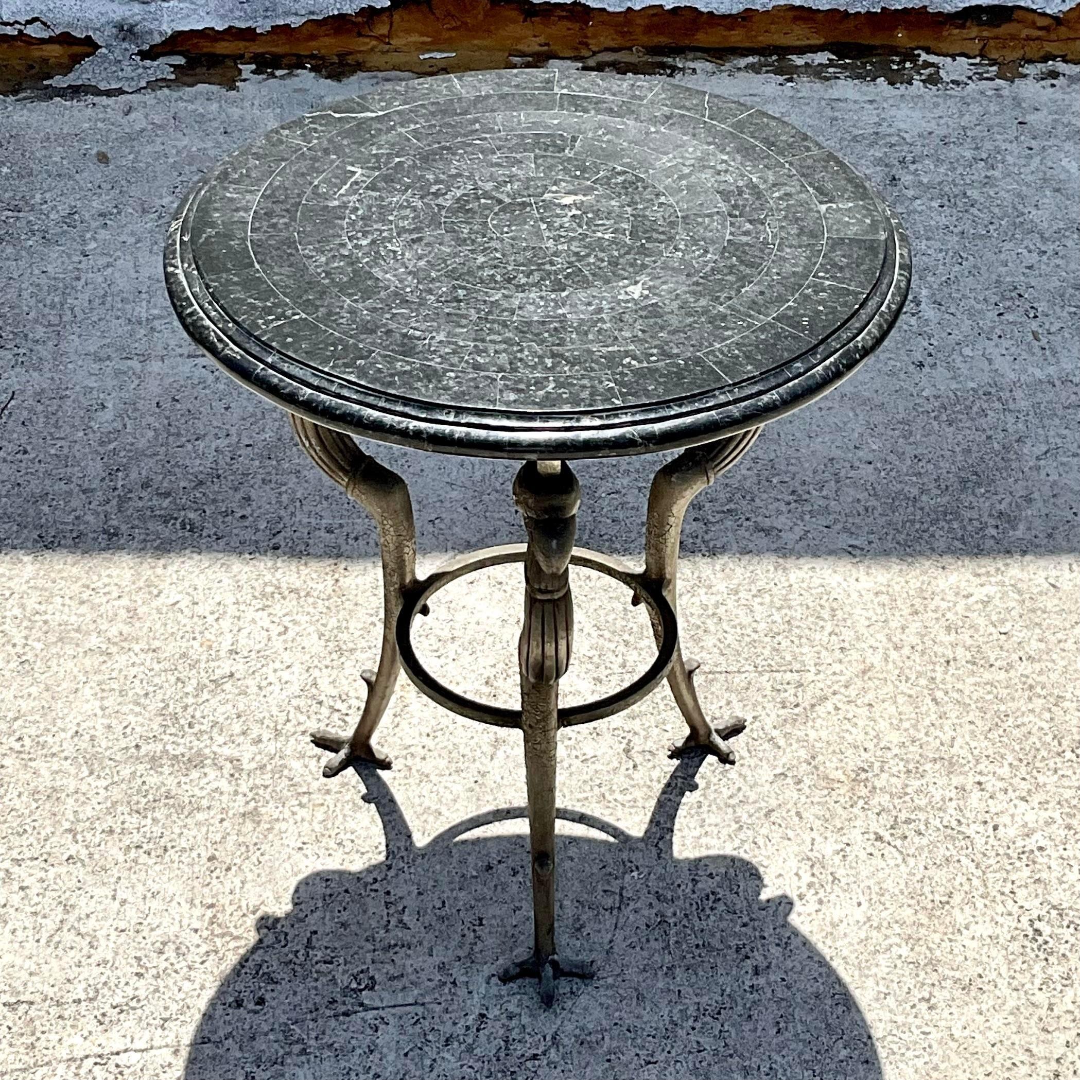 Introduce a touch of opulence to your space with this Vintage Regency Maitland Smith Phoenix Head Drinks Table. This American-style piece features a striking phoenix head design, epitomizing luxury and sophistication. Perfect for serving drinks or