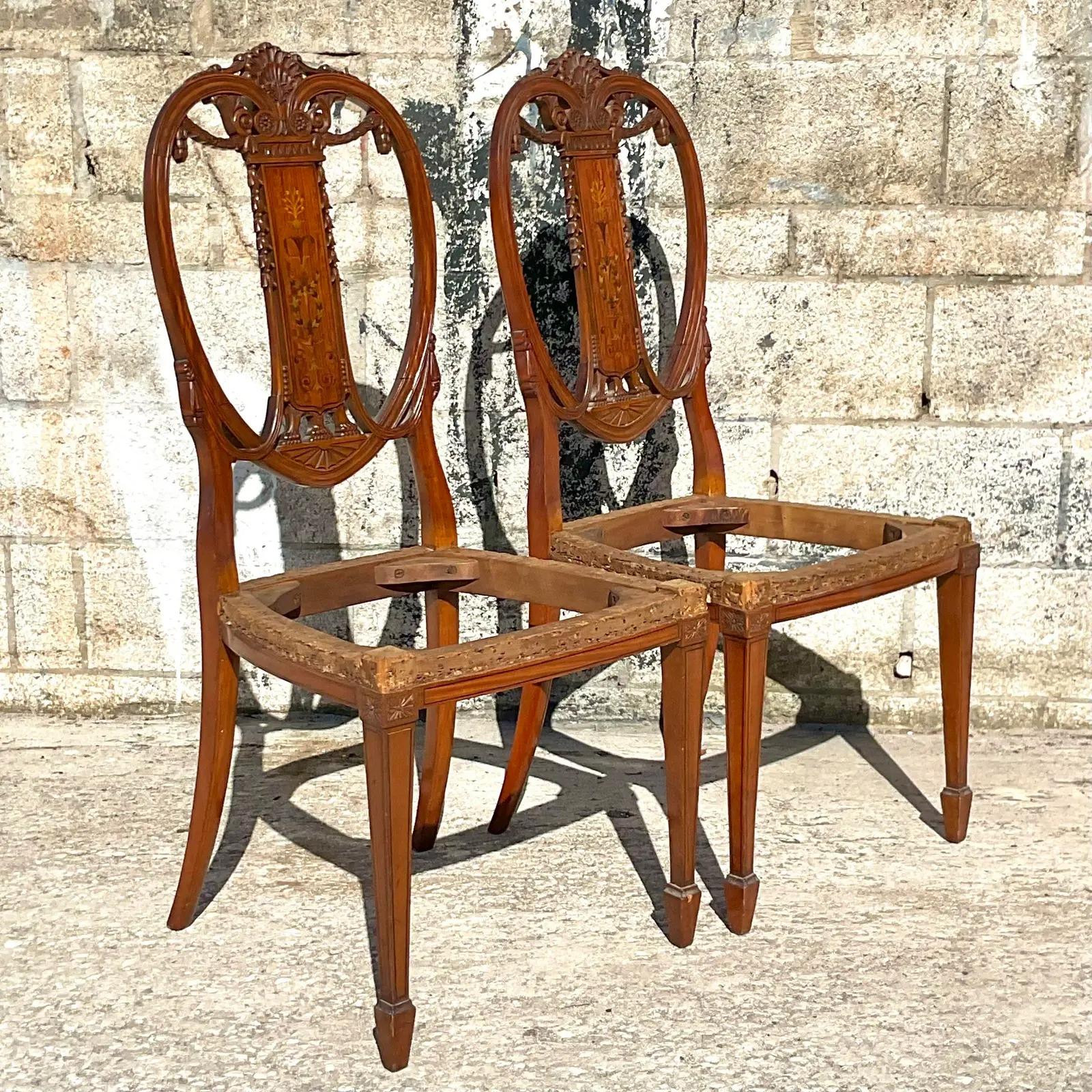 Vintage pair of Regency Balloon back dining chairs. Beautiful hand carved swags with chic inlay marquetry detail. We removed the seats so it’s all set for you to add your own fabric! Acquired from a Palm Beach estate.

