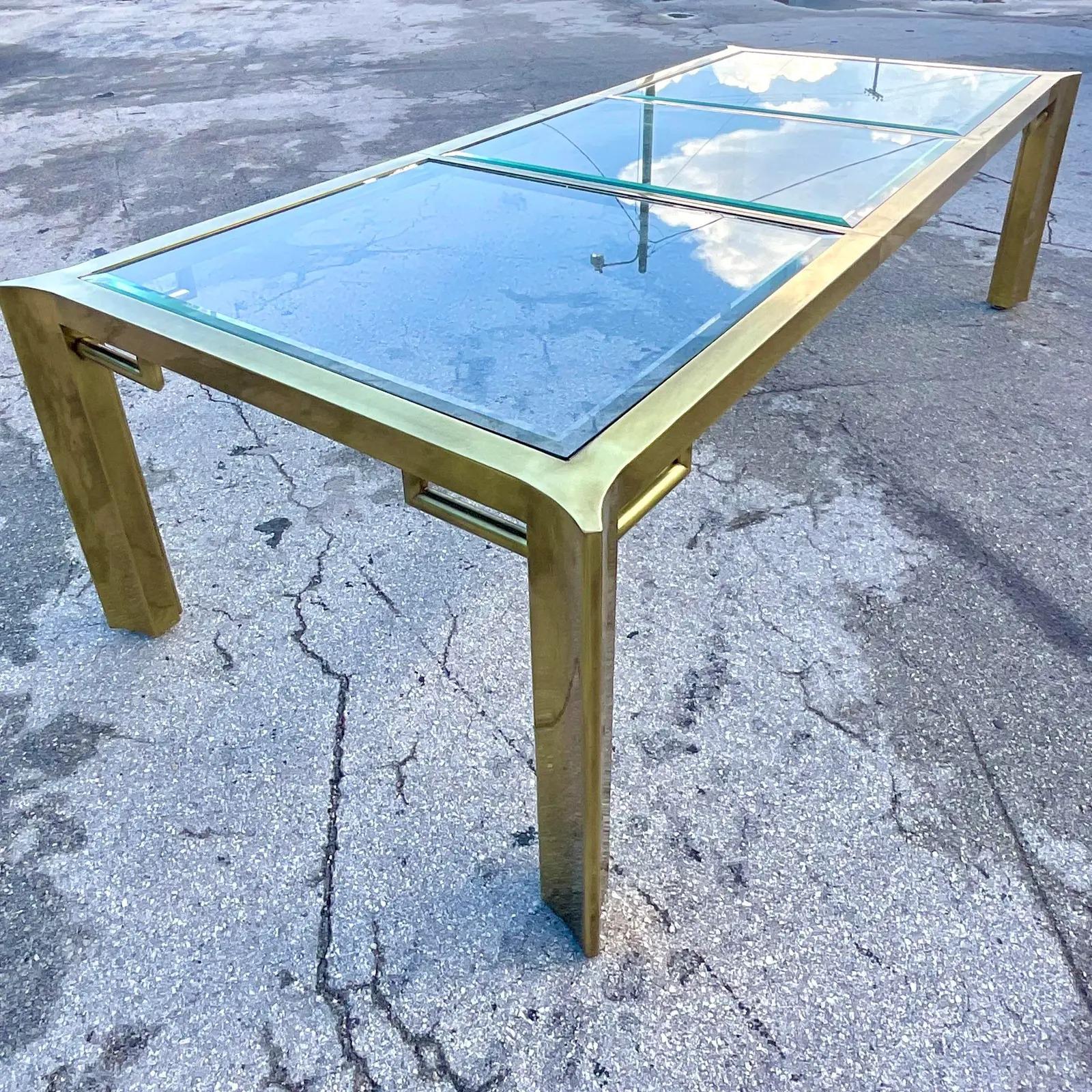 Fantastic vintage Regency dining table. Made by the iconic Mastercraft. A limited edition that is numbered below. Inset glass panels on top with one leaf to extend. Acquired from a Palm Beach estate.