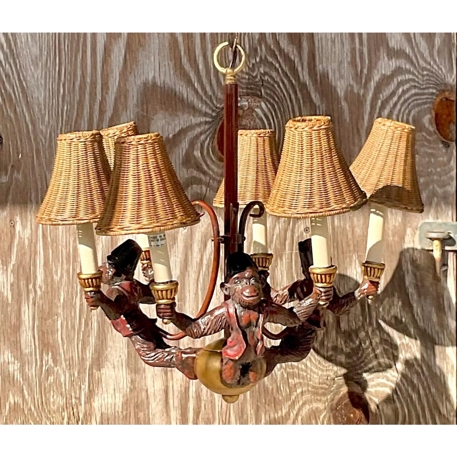 A fantastic vintage Boho chandelier. The iconic monkey design in warm rich colors. Little rattan shades add to the charm. Acquired from a Palm Beach estate
