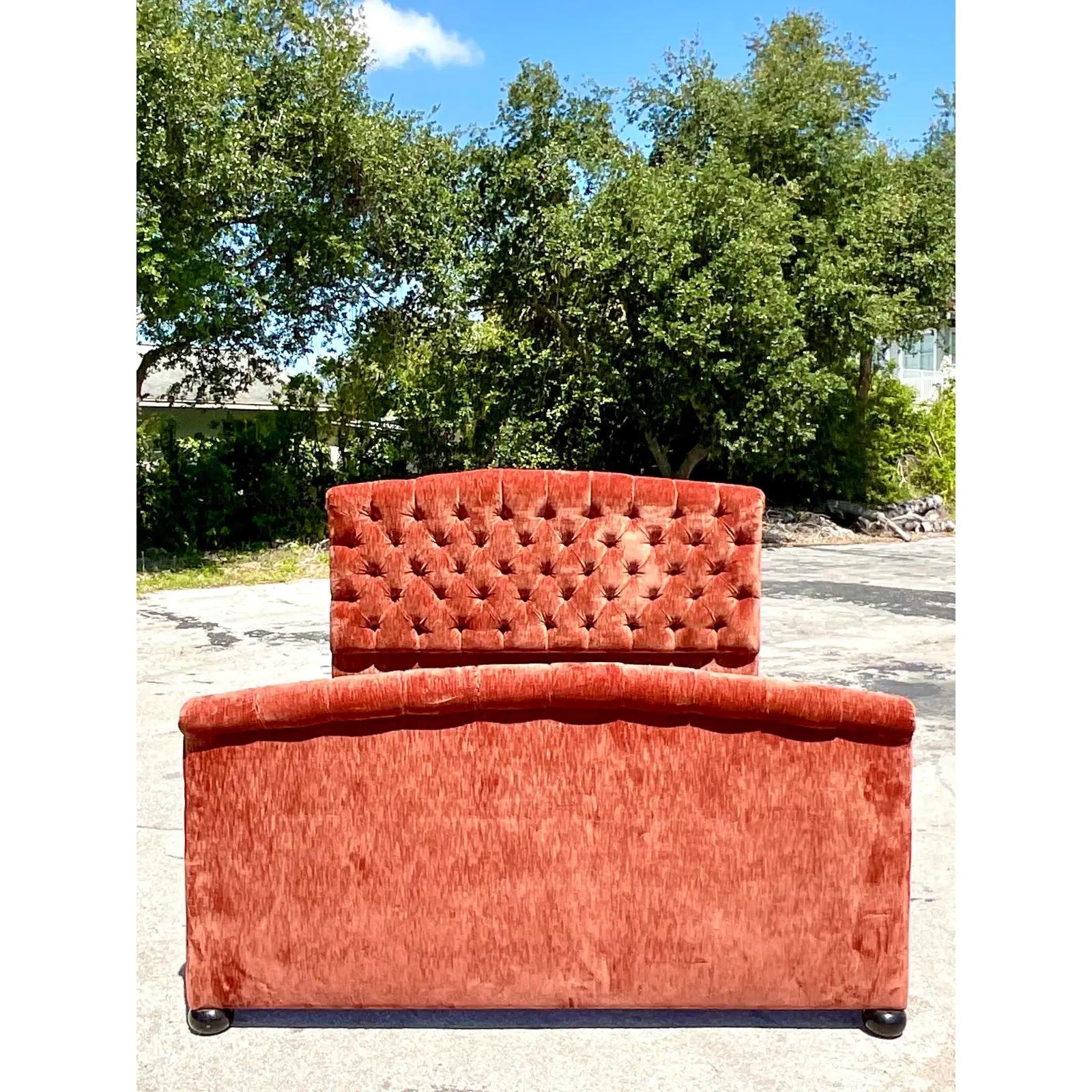 Incredible vintage custom made King bed. Covered in luxurious Lino Lavato burnt orange velvet in a chic tufted design. Glamorous Hugh back and foot board. Acquired from a Palm Beach estate.