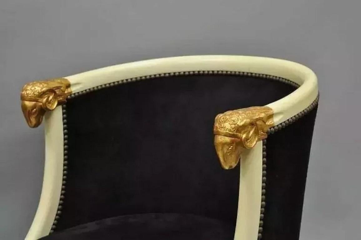Vintage Regency Neoclassical Style Ram's Head Hoof Feet Club Chairs - a Pair. Item features heavy solid carved wood frames, ram's head armrests, hoof feet, shapely barrel backs and blackish brown suede upholstery with nail head trim. Chairs are