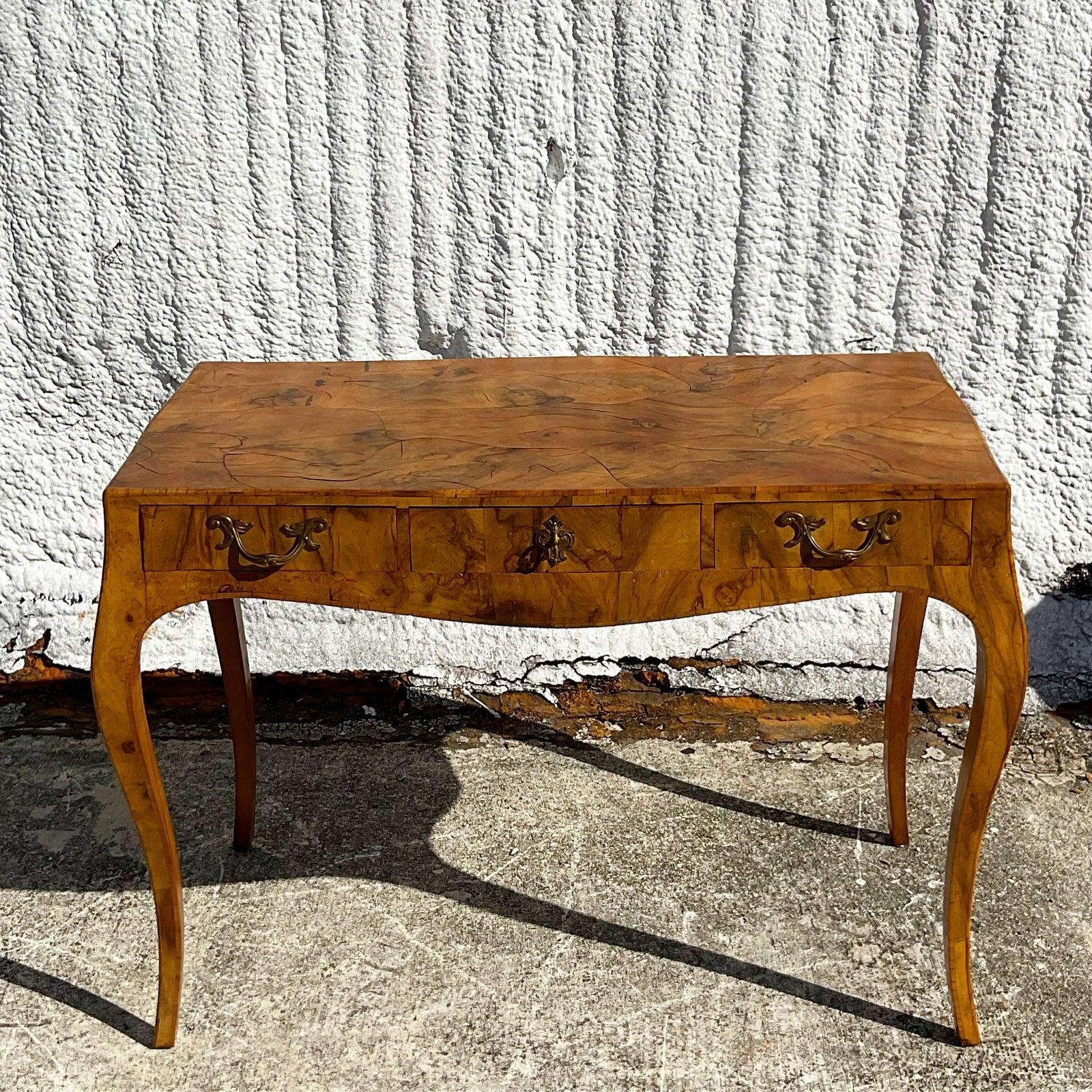 Fantastic vintage Olive burl wood writing desk. Beautiful wood grain detail and cabriolet leg. Made in Italy. Acquired from a Palm Beach estate.