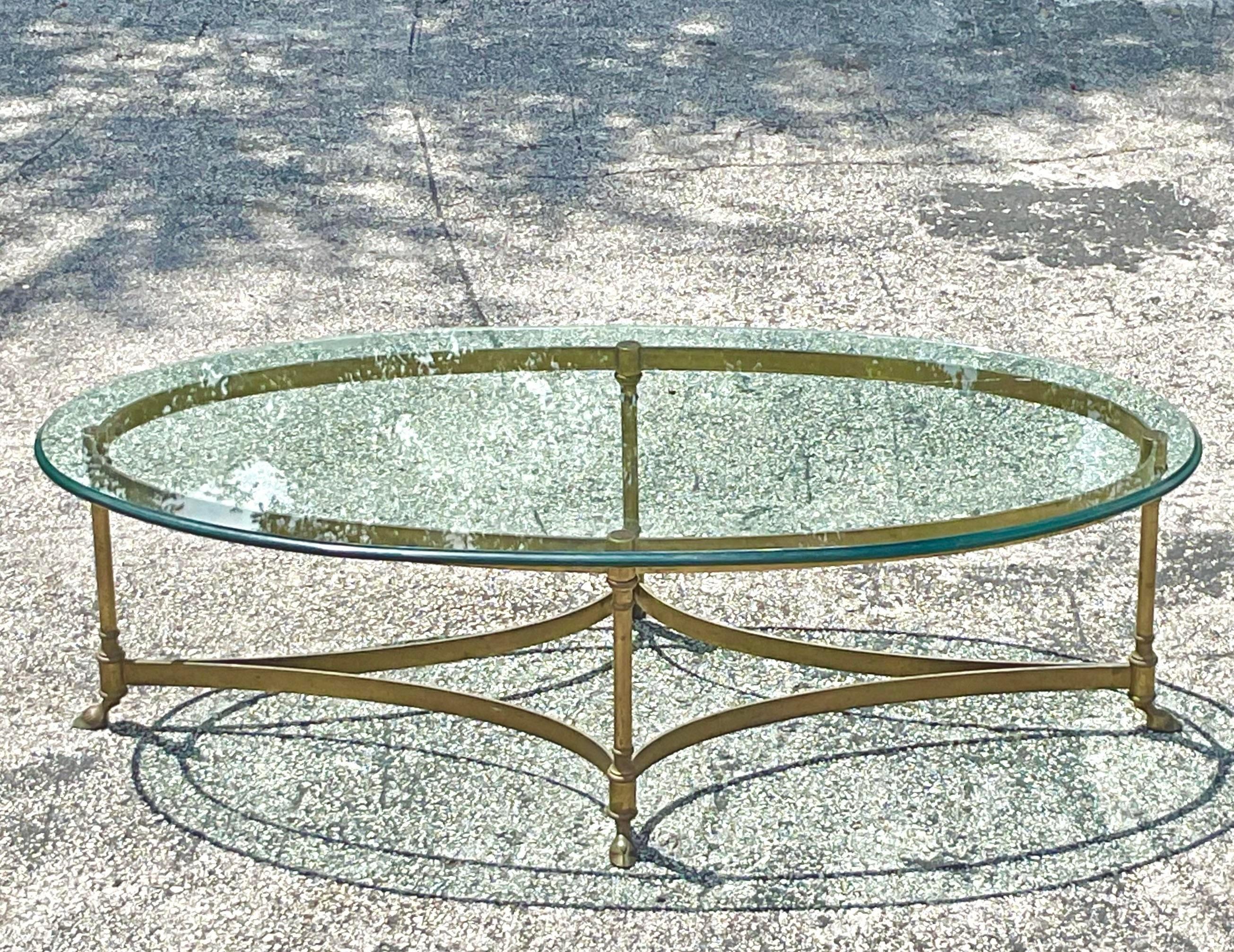 20th Century Vintage Regency Oval Brass Claw Foot Coffee Table