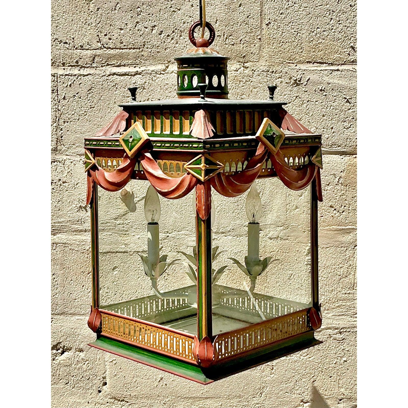 Make a dramatic statement with this Vintage Regency Painted Swag Lantern, a charming fusion of theatrical design and old-world craftsmanship. This electrified lantern features a hand-painted metal frame in regal hues of forest green, terracotta, and