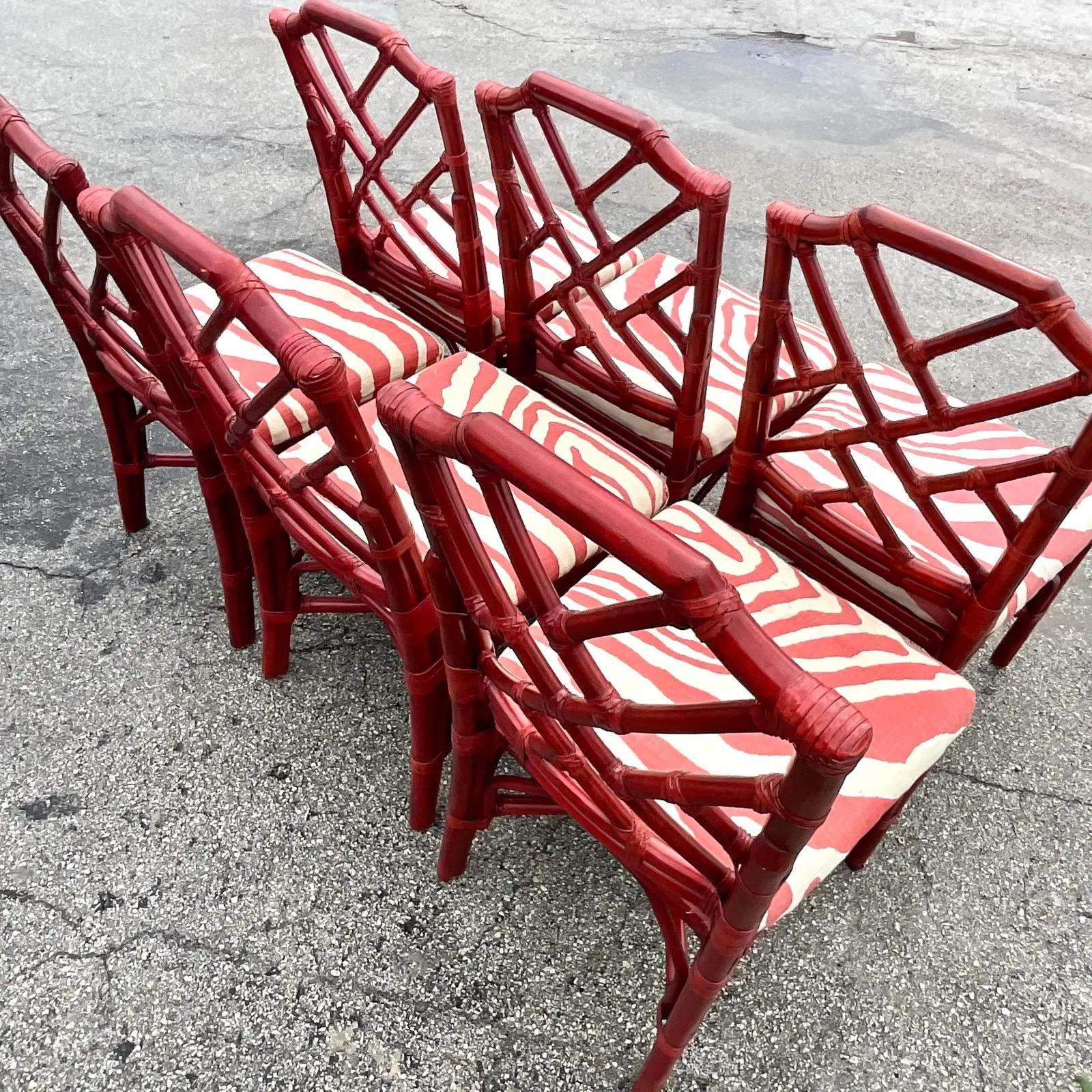 Fantastic set of six Regency Palecek rattan dining chairs. A beautiful crimson color in the iconic Chinese Chippendale design. Acquired from a Palm. Each estate.

The chairs are in great vintage condition. Minor scuffs and blemishes appropriate to