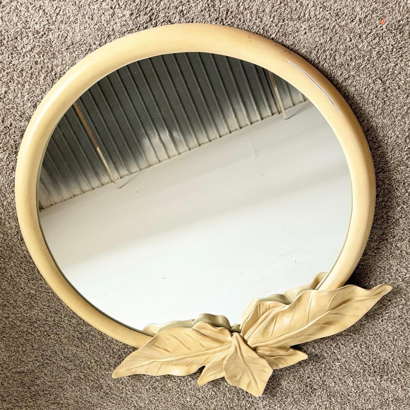 Discover the elegance of this Vintage Regency Palm Leaf Wall Mirror, attributed to Serge Roche. Its intricately designed frame and gold-tone finish add sophistication to any space.
