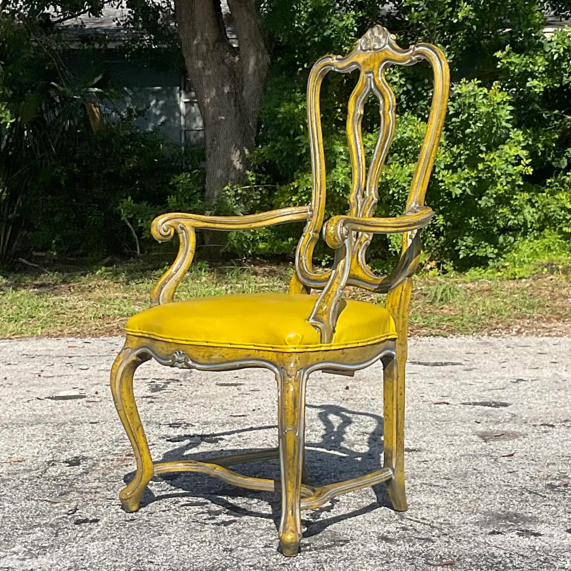 A fabulous vintage Regency desk chair. Made by the Palma group in NYC. A chic high Bach chair with cabriolet legs and a carved clamshell motif on top. A fabulous antiqued yellow finish. Acquired from a Palm Beach estate. 