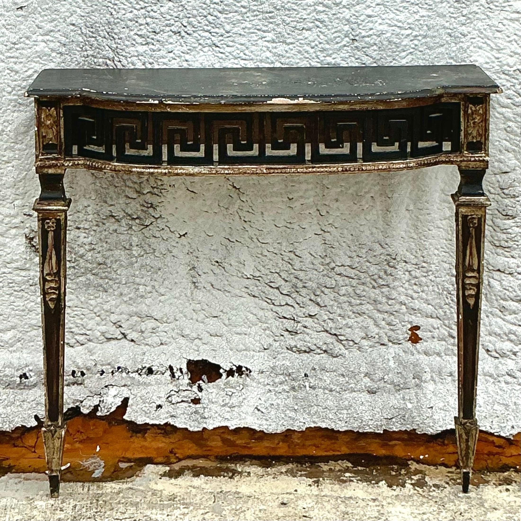 Elevate your interior with our Vintage Regency Patinated Greek Key Wall Mount Demilune Console Table. Featuring a classic Greek key motif and a rich patinated finish, this console table blends timeless Regency elegance with refined American style,