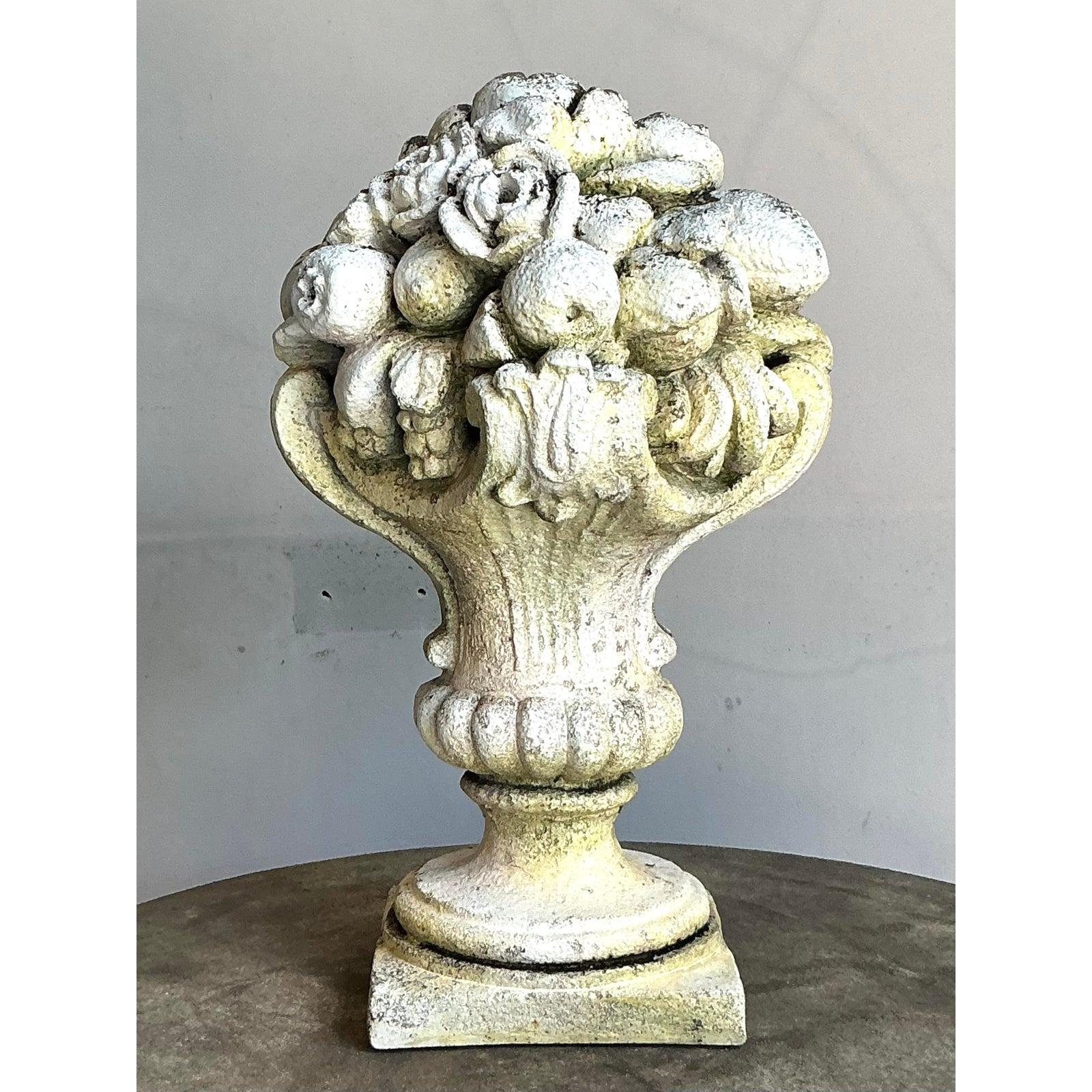 Embodying timeless classical elegance, this exquisite Vintage Regency Patinated Resin ornament is a magnificent sculptural statement piece. Designed in the ornate Regency style, it features a beautifully rendered classical urn base overflowing with