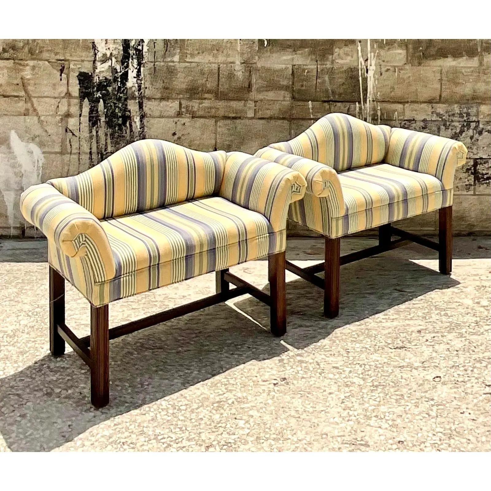 Super charming pair of vintage petite sofas. Classic camelback design in a chic awning stripe. Small is size, but big on glamour. Acquired from a Palm Beach estate.