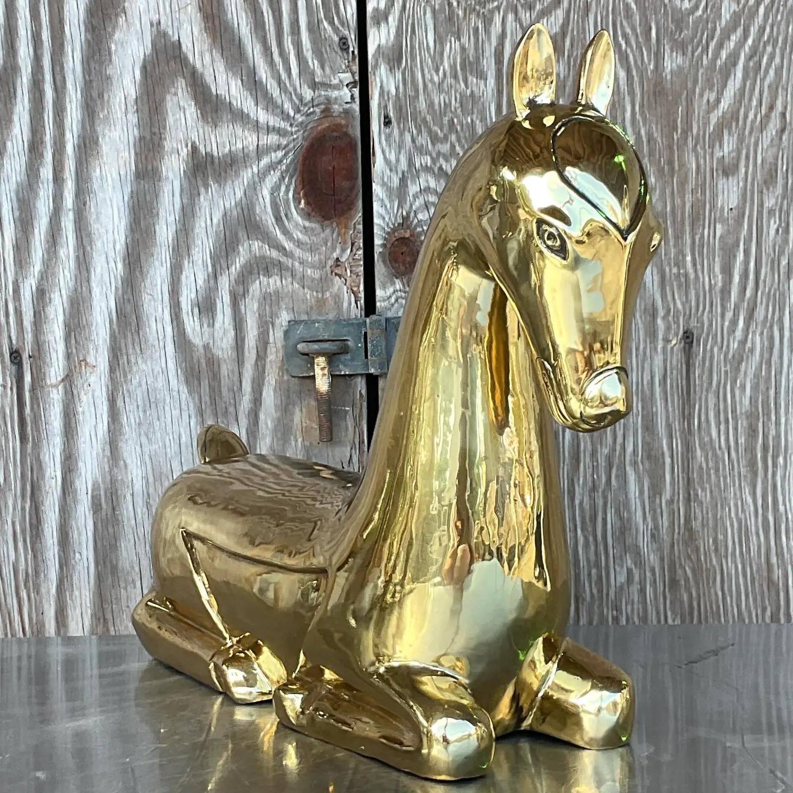 A stunning vintage Regency brass horse. A chic composition in a high polished finish. Unmarked. He had a tag, then I sent him out to be polished and they removed it. Acquired from a Palm Beach estate.