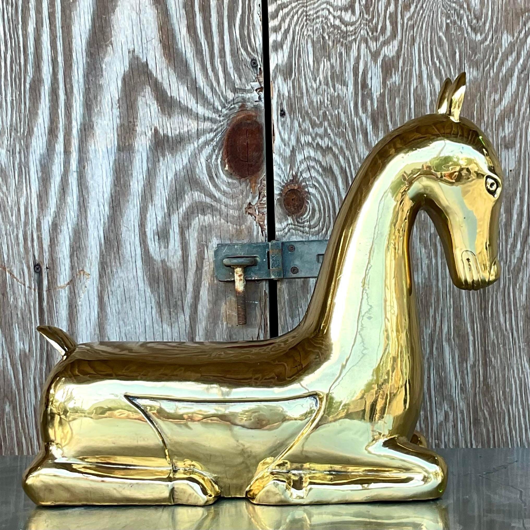 A stunning vintage Regency brass horse. A chic composition in a high polished finish. Unmarked. He had a tag, then I sent him out to be polished and they removed it. Acquired from a Palm Beach estate.