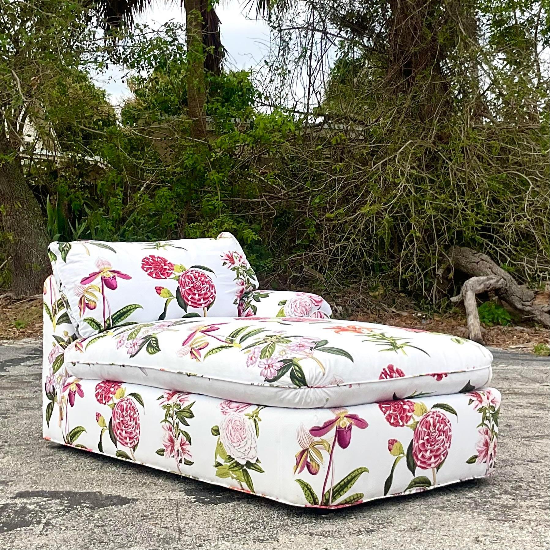 A stunning vintage Regency chaise lounge. A brilliantly colored floral print on cotton jacquard. Down filled cushion. Coordinating pieces also available on my page. Acquired from a Palm Beach estate. 
