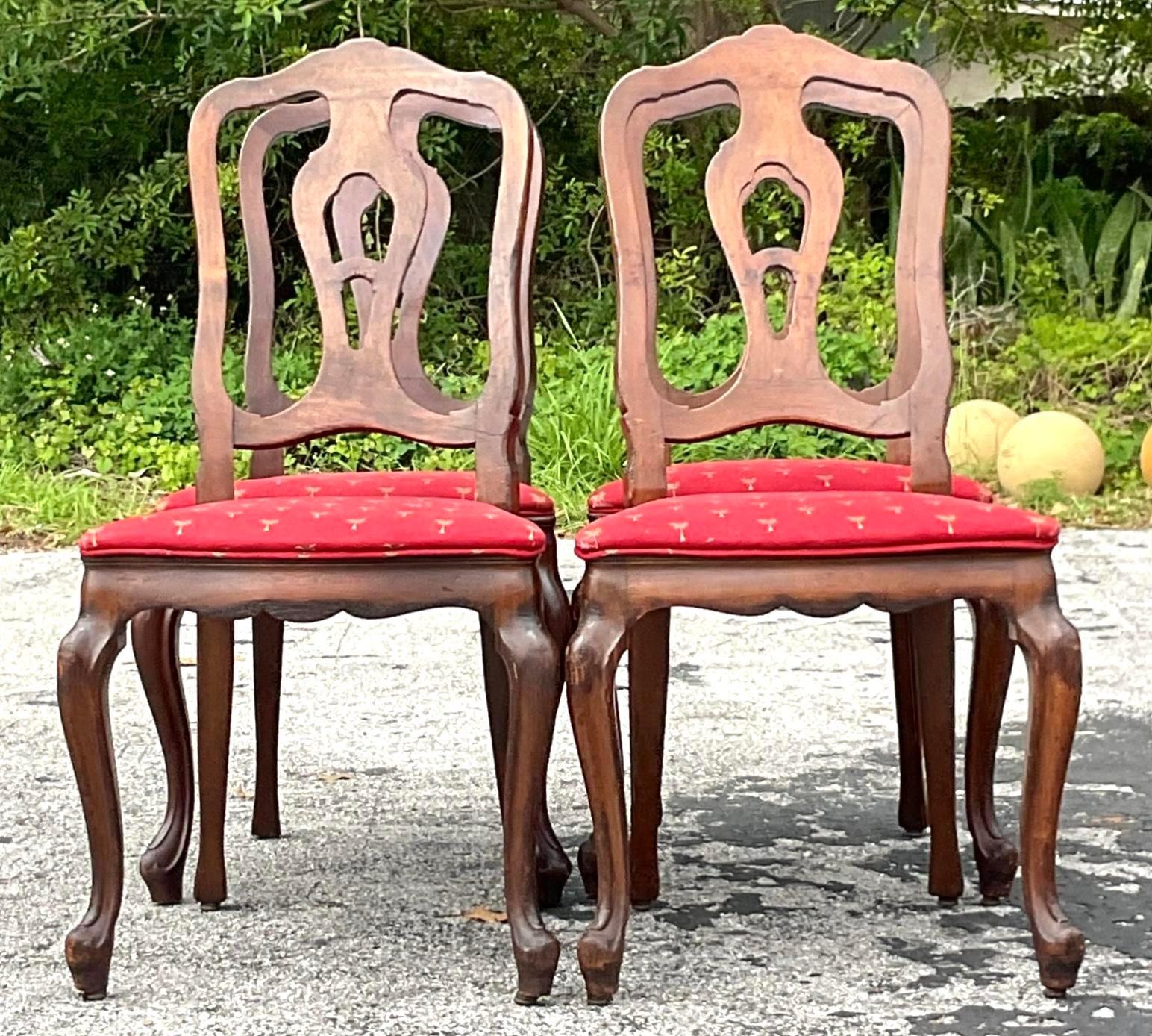 A sophisticated set of American-style vintage Regency Queen Anne dining chairs, showcasing graceful lines and exquisite craftsmanship. These chairs elegantly combine the timeless Queen Anne silhouette with Regency-era detailing, perfect for adding a