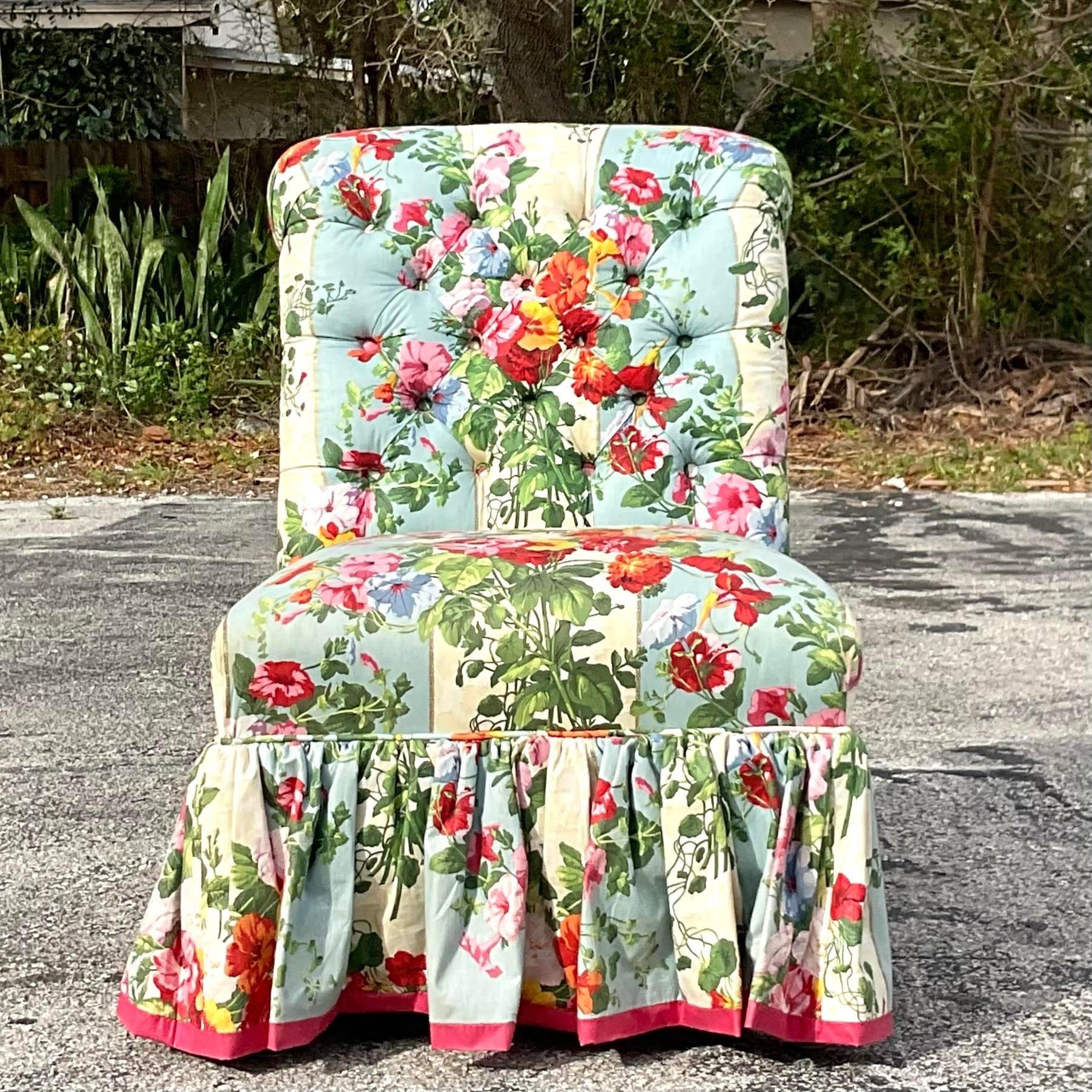 A stunning vintage custom Regency slipper chair. A chic quilted floral in bright, clear color. A grosgrain ribbon trim detail along the bottom. Matching club chair also available on my page. Acquired from a Palm Beach estate.