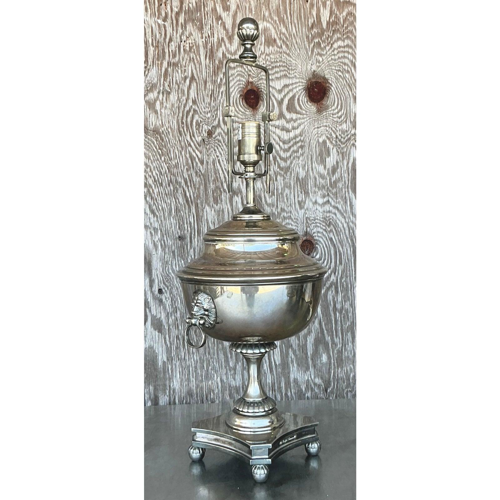 Embodying timeless sophistication and classic design, this vintage table lamp by Ralph Lauren is a stunning example of Regency-style elegance. The lamp features a beautifully proportioned silver-plated body in the form of a traditional English urn