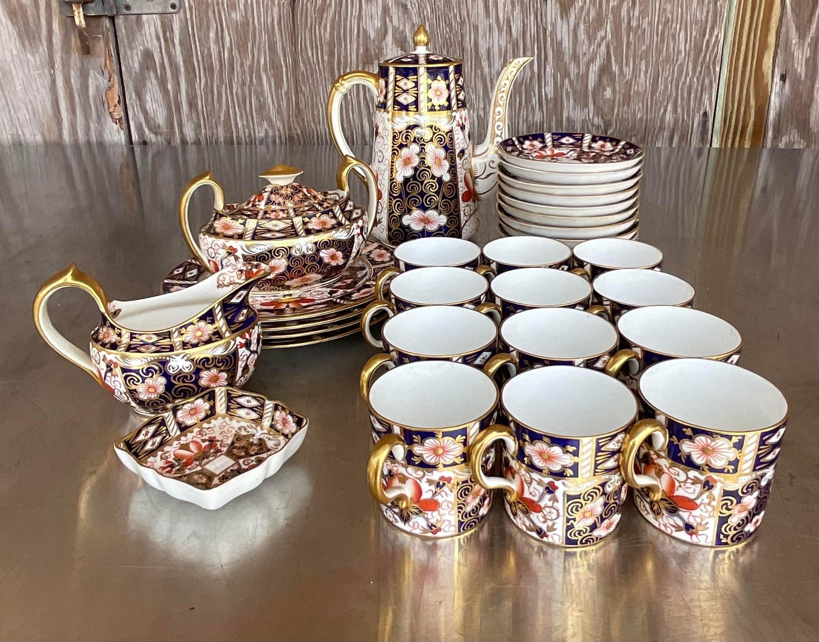 A fantastic vintage Regency coffee and tea service. Made by the iconic Royal Crown Derby group. The traditional Imari 2451 style with 32 pieces total. The set includes two different stamps- some have the classic RCD logo and Some are stamped RCD