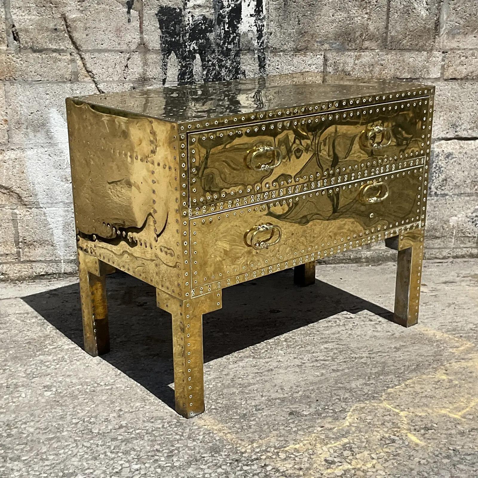 Incredible vintage Regency brass chest of drawers. Beautiful nailhead detail with a bright mirrored brass shine. Acquired from a Palm Beach estate.
