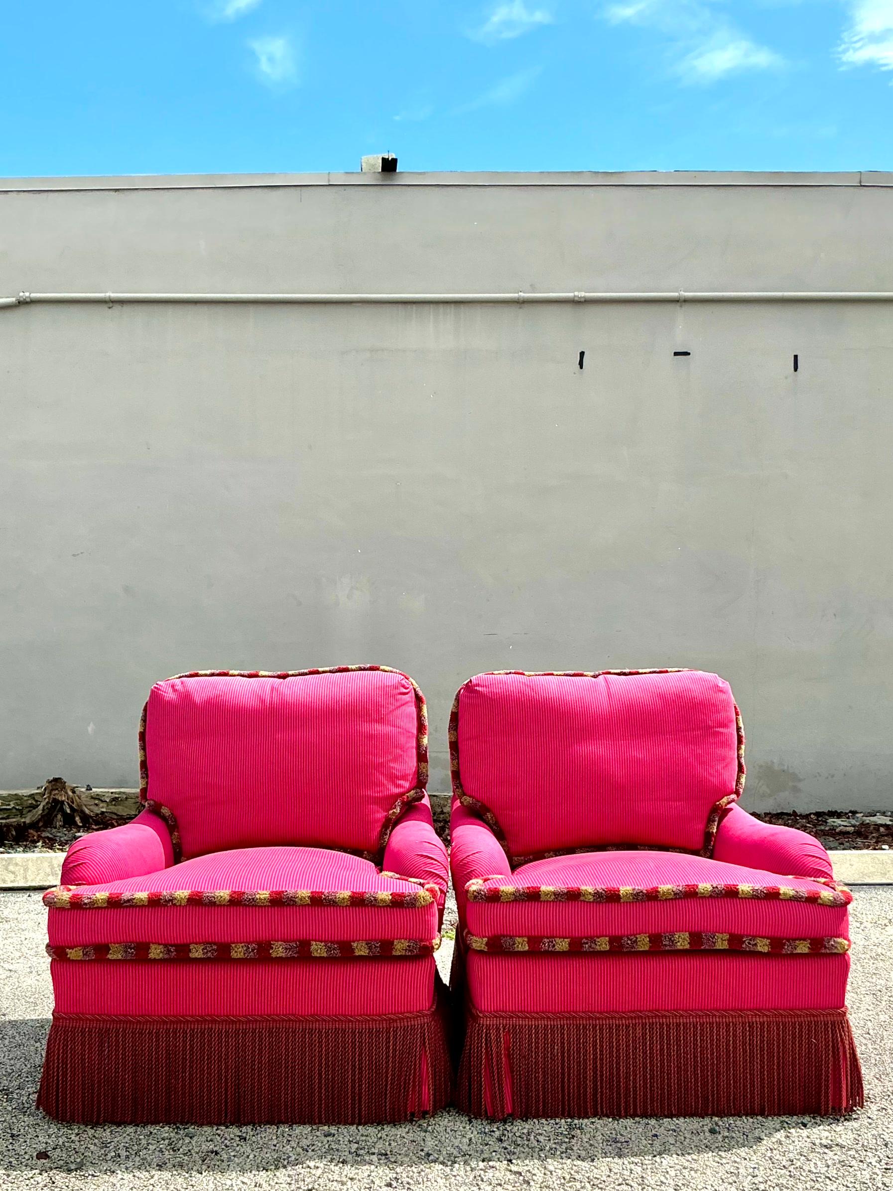 Indulge in luxurious comfort with the American style Vintage Regency Shadow Stripe Down Lounge Chairs - A Pair. These chairs showcase elegant shadow stripe upholstery, catepilliar fringe and plush down filling, epitomizing Regency sophistication.