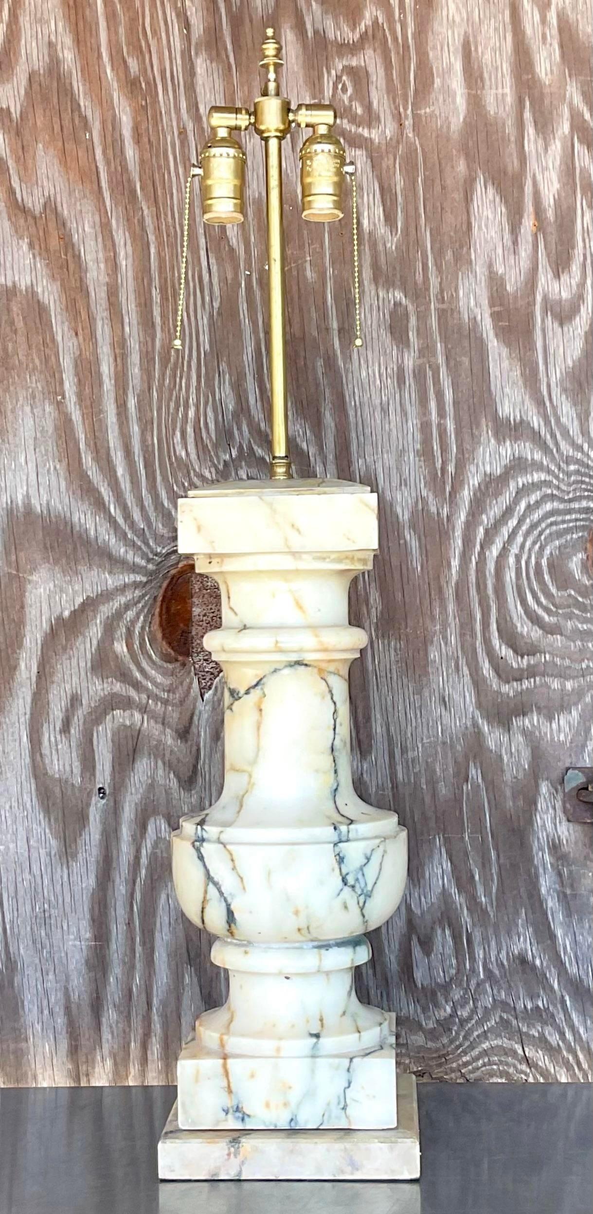 A fantastic vintage Regency lamp. A beautiful solid marble with gorgeous vein detail. The top of the lap has the most amazing hand painted faux marbling. Acquired from a Palm Beach estate.