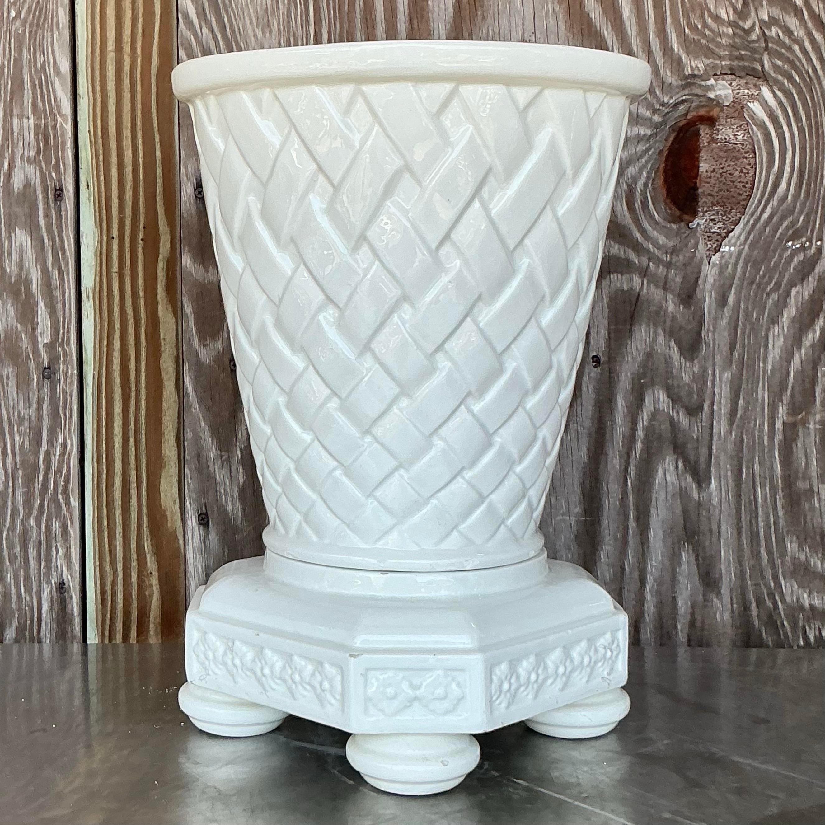 Add a touch of European elegance to your space with this Vintage Regency Spanish Glazed Ceramic Trellis Planter. This stunning planter features a rich, hand-glazed finish and intricate trellis patterns that evoke the timeless charm of Spanish