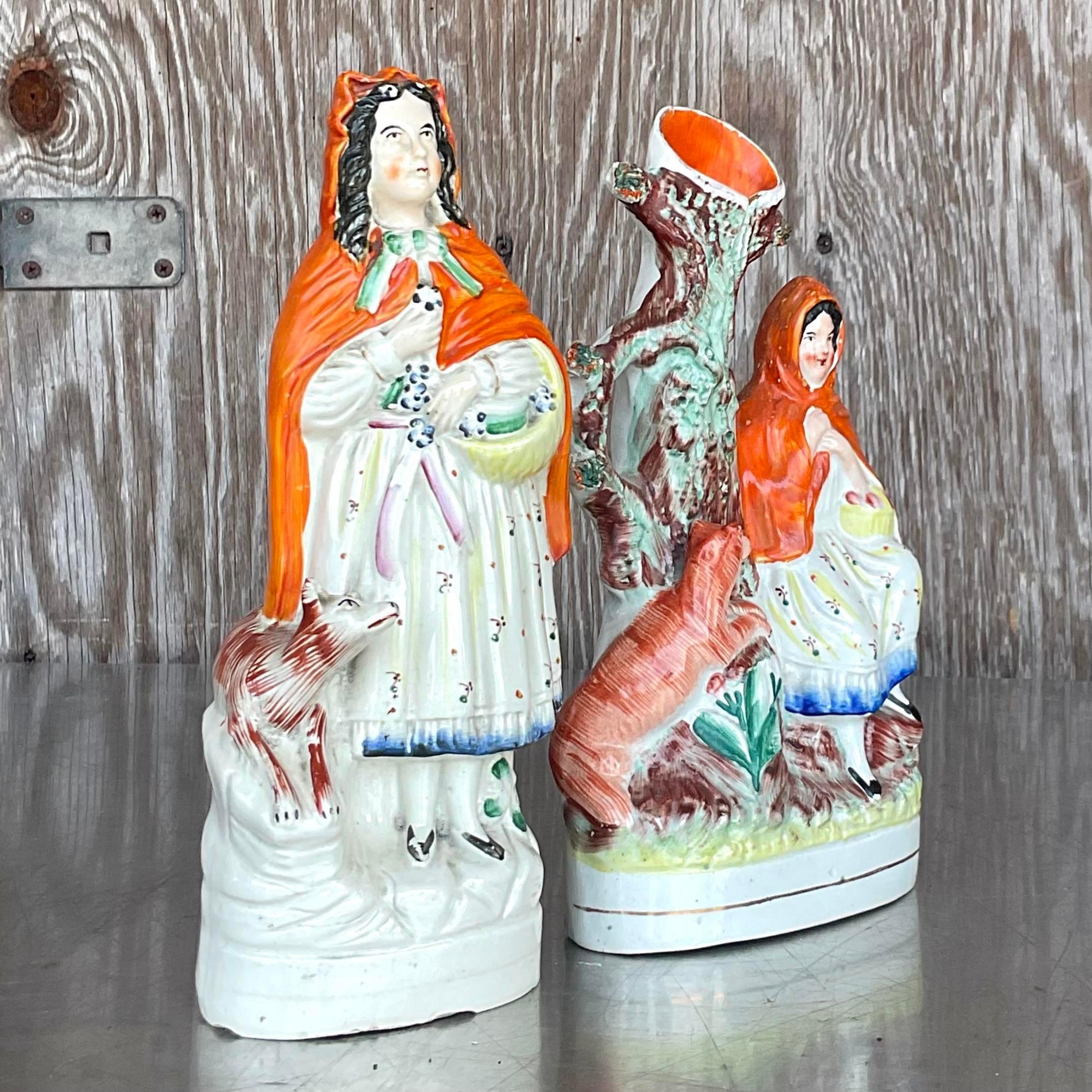 A fabulous vintage pair of Staffordshire style figurines. A classic set of two women in period dress. Acquired from a Palm Beach estate