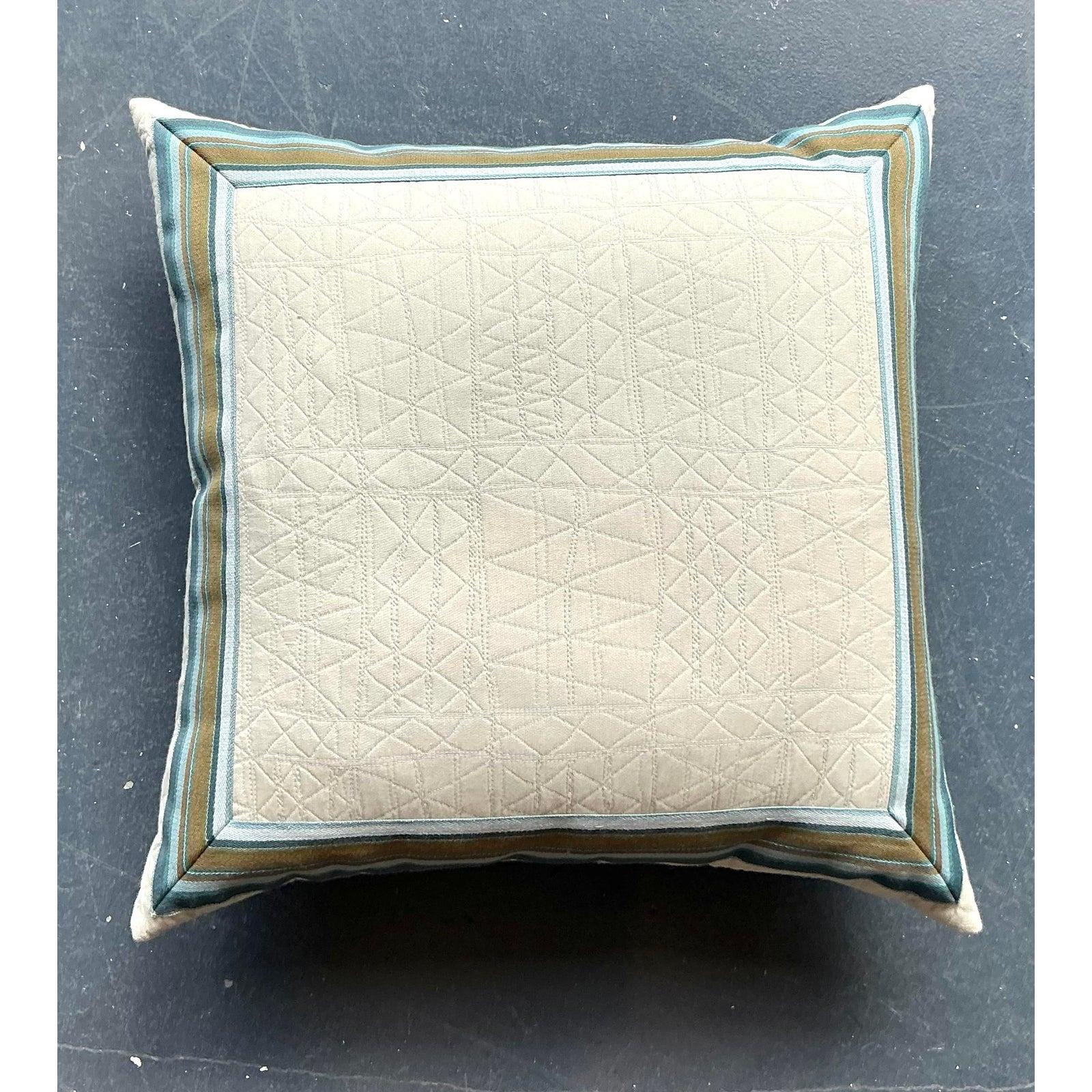 Introduce a touch of refined elegance with this vintage Hollywood Regency striped throw pillow, a sophisticated accent piece designed to elevate any luxurious interior. This exquisite pillow features a subtly quilted, light-toned center, beautifully