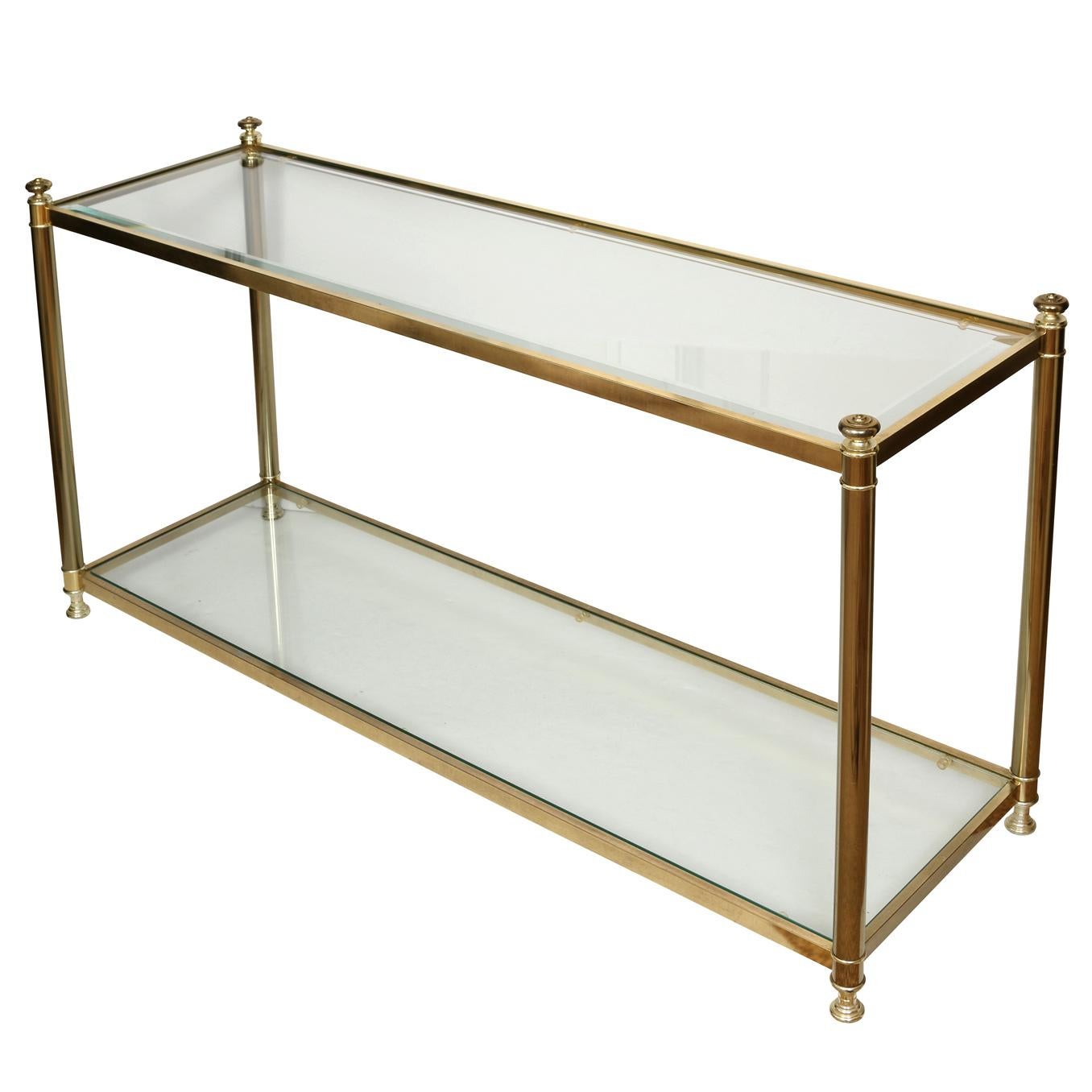 A Regency style vintage brass and glass console table with a lower glass shelf.