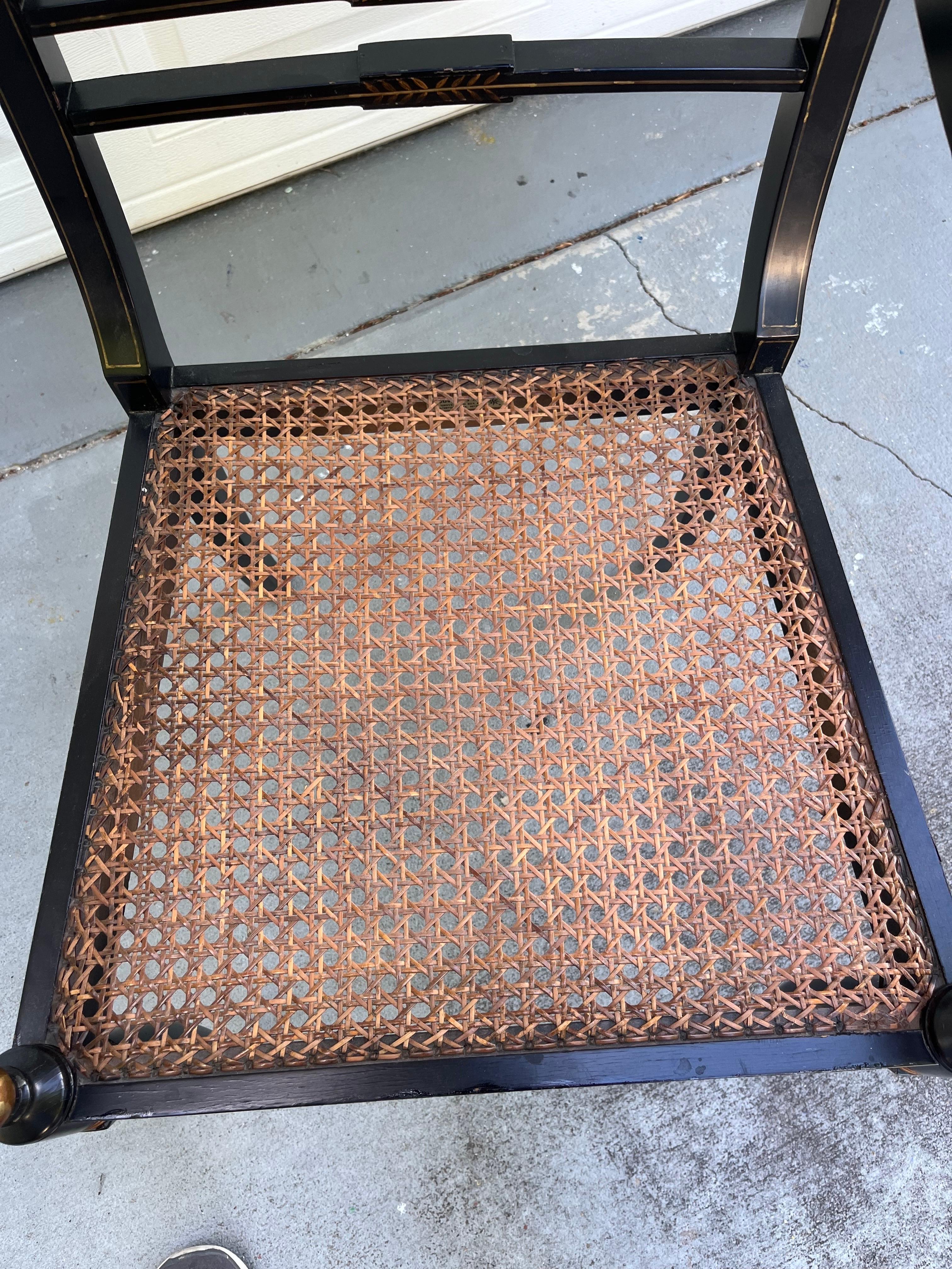 20th Century Vintage Regency Style Ebonized Armchair with Cane Seat.