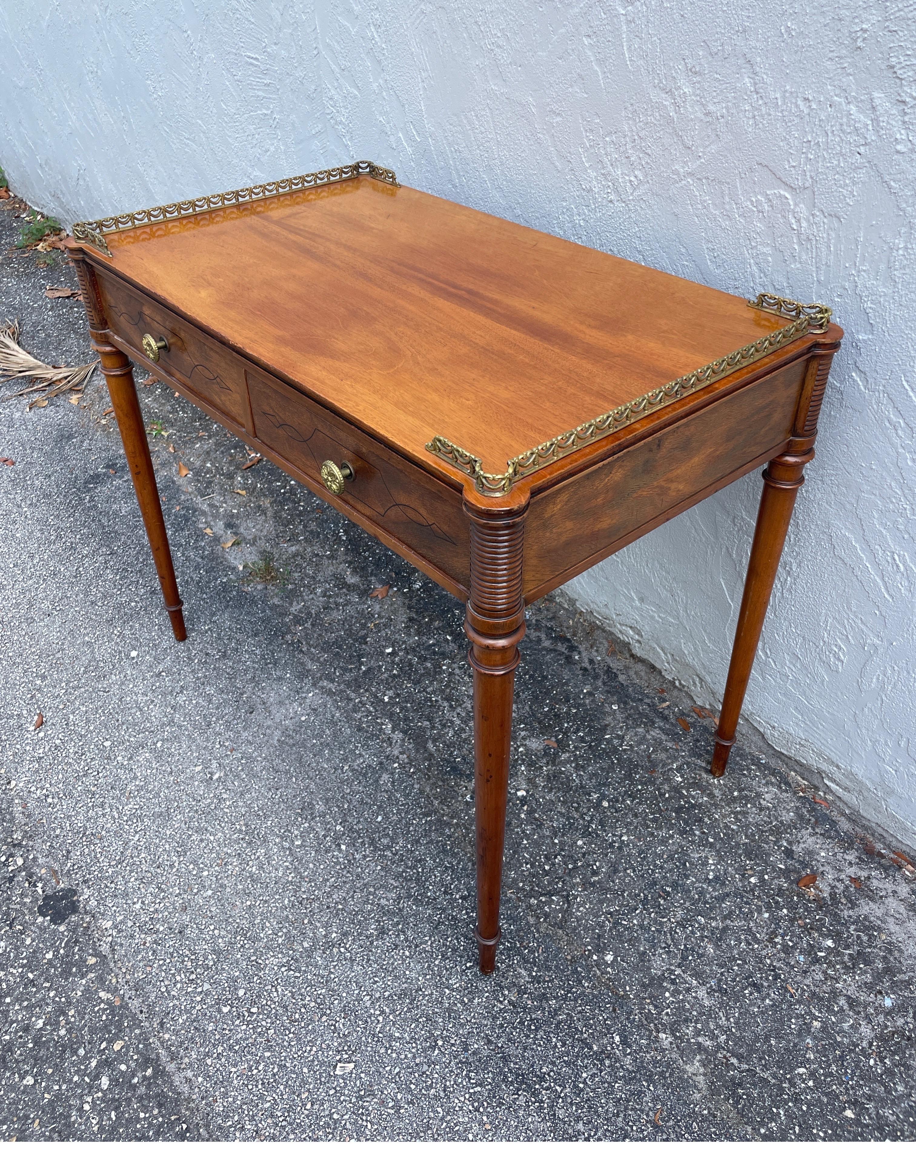 Vintage Beacon Hill small partner's desk / server with brass gallery and turret corners. Originally made for B. Altman & Co. Drawers can be accessed from both sides. A very versatile piece.