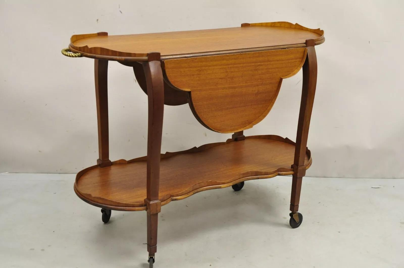Vintage Regency Style Mahogany Drop Leaf Rolling Server Cart Buffet. Circa Mid 20th Century. Measurements: 35