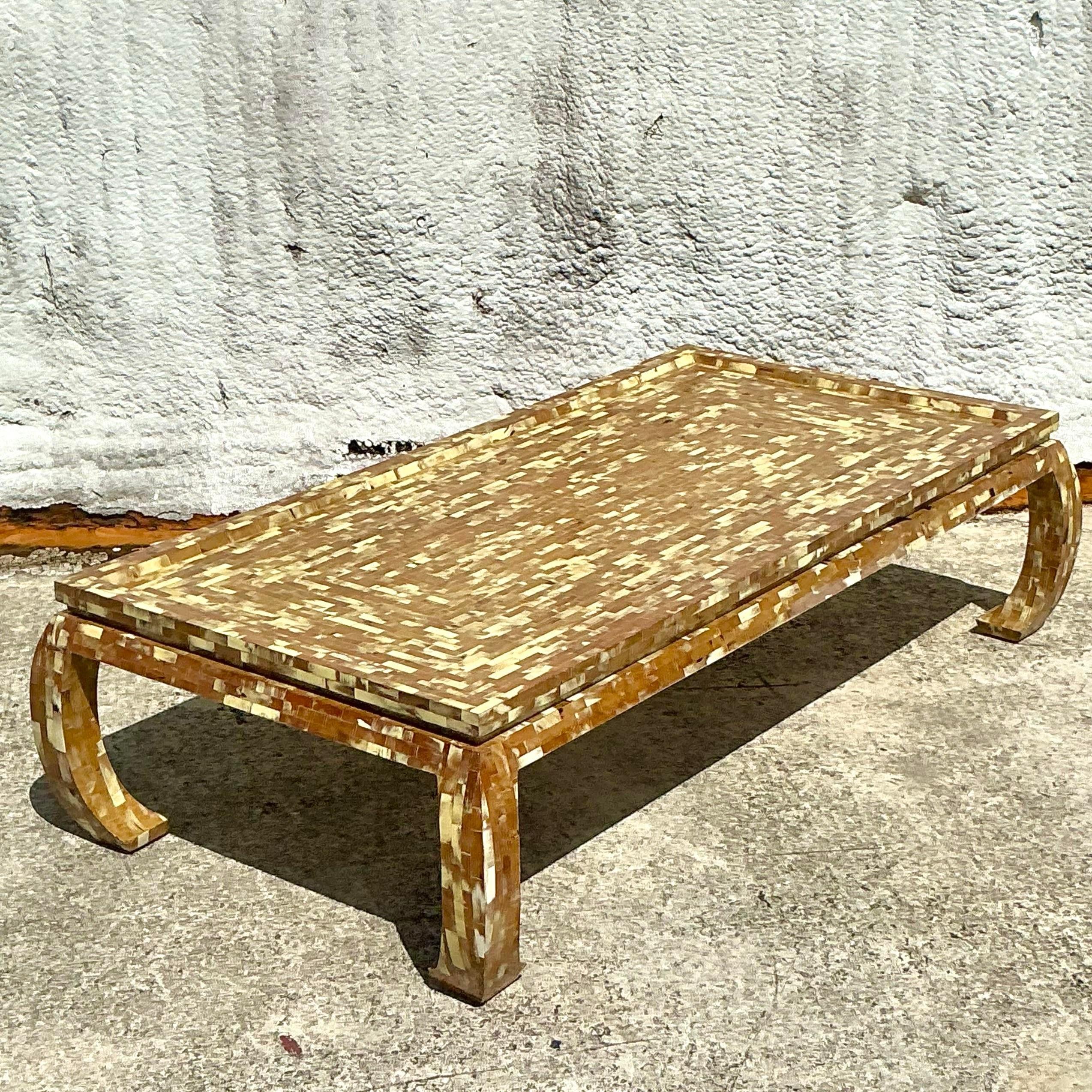This vintage Regency coffee table showcases a striking tessellated horn design with a Ming-inspired silhouette. A sophisticated blend of texture and form, it's a standout piece that adds an exotic touch to any living space