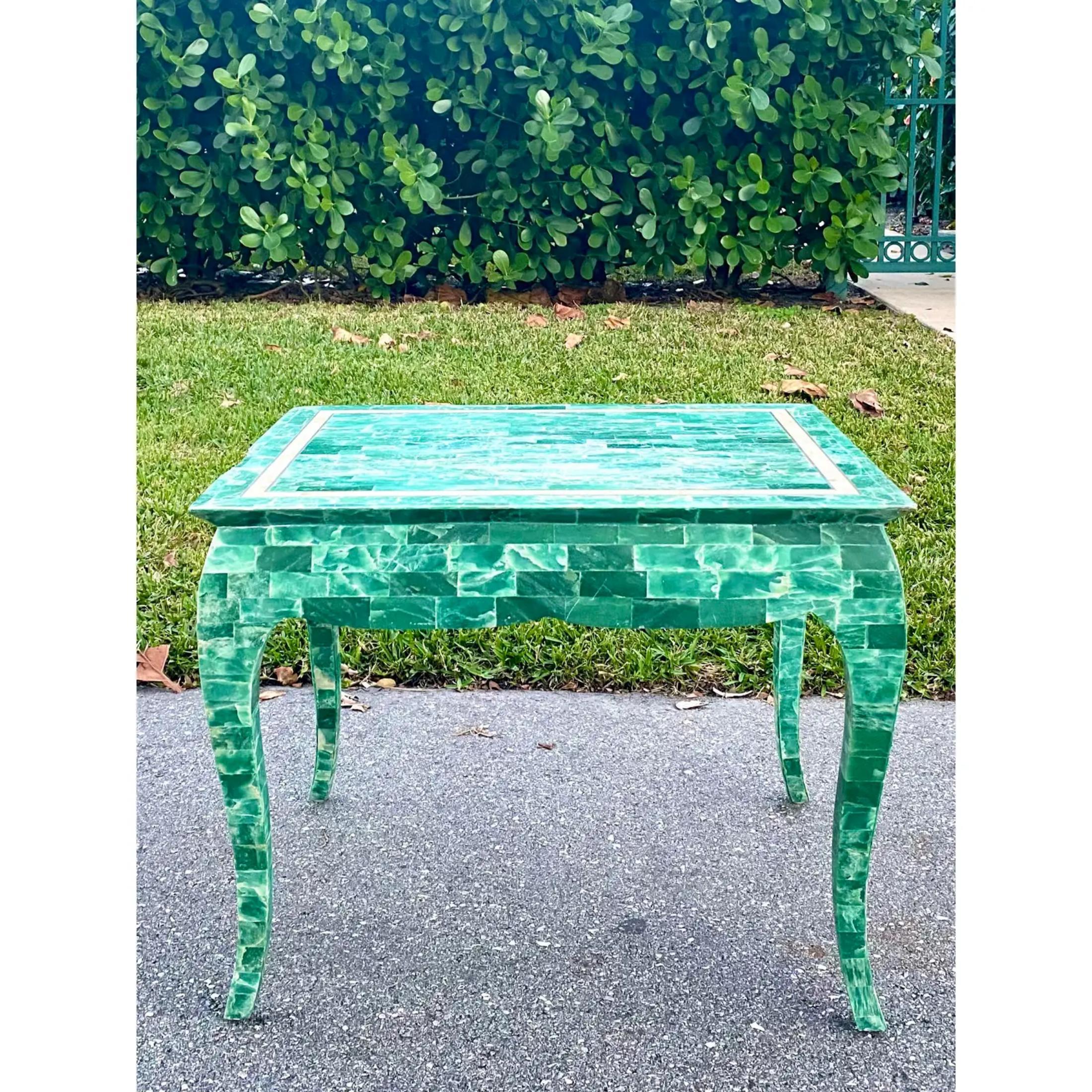 Outstanding tessellated stone side table. A brilliant green color and inlay brass detail make this a real collectors item. Cabriolet legs make this a perfect and dramatic side table, but would also be genius as a high coffee table. Acquired from a