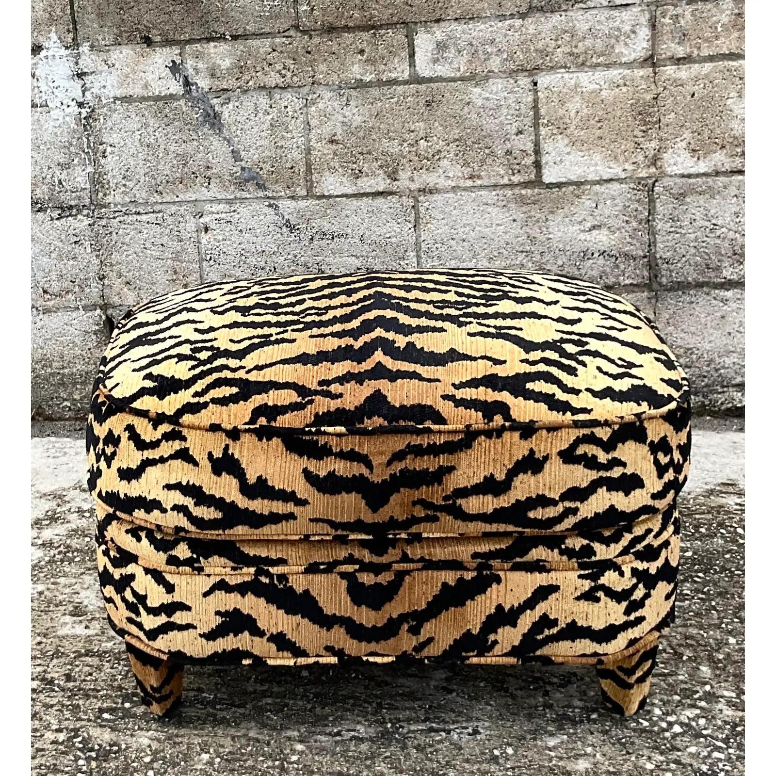 Fantastic vintage Devore upholstered ottoman. Chic tiger design fabric after the iconic Scalamandre fabric. Acquired from a Miami estate.