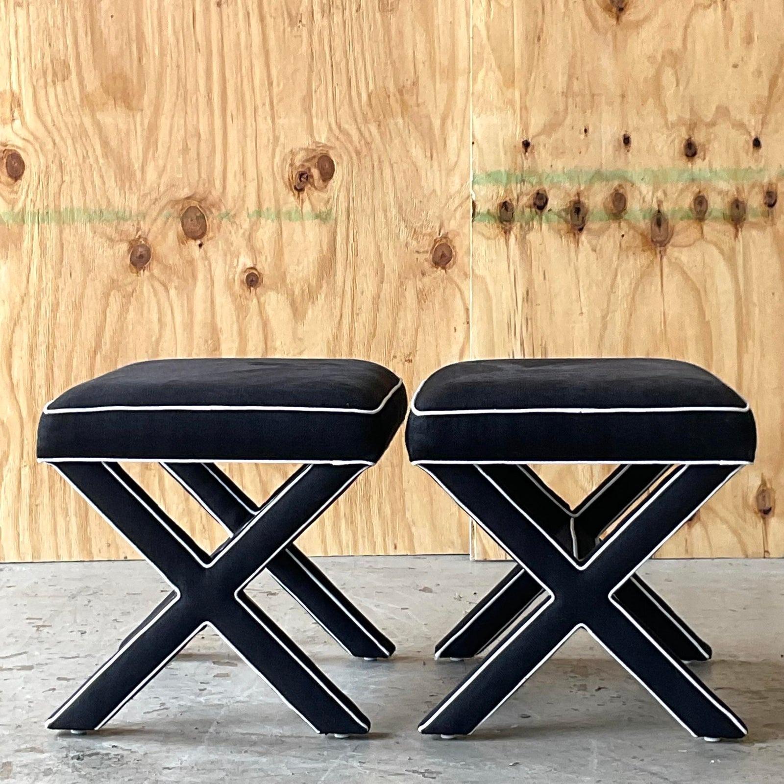 A stunning pair of custom built X Benches. A chic black linen/cotton in black with perfect white tipping along the edge. A graphic sensation. Acquired from a Palm Beach estate.