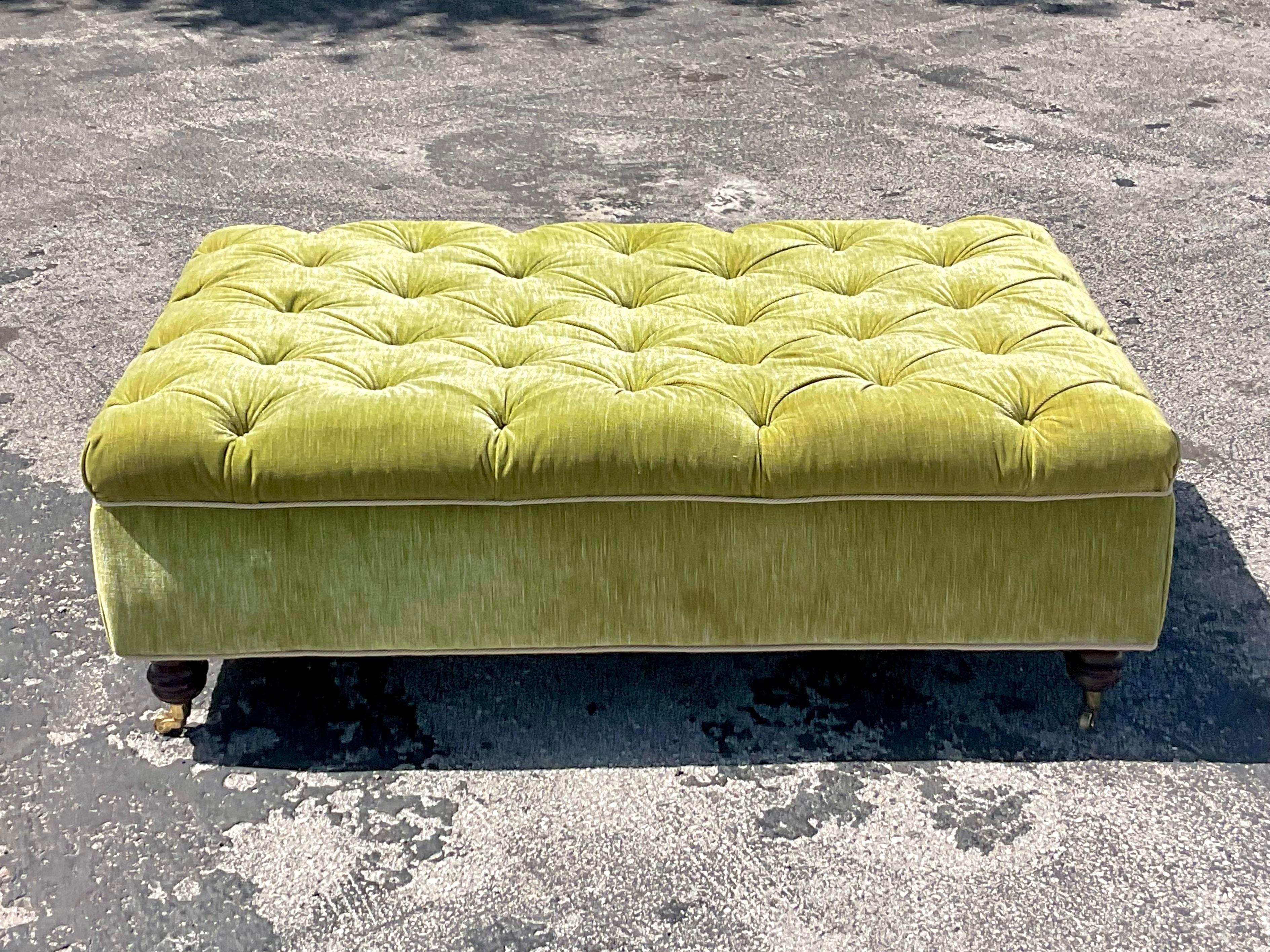 A fabulous vintage Tufted ottoman. A classic turned wooden leg design with a bright apple green velvet. Perfect as is or reupholster to coordinate with your project. You decide! Acquired from a Palm Beach estate.